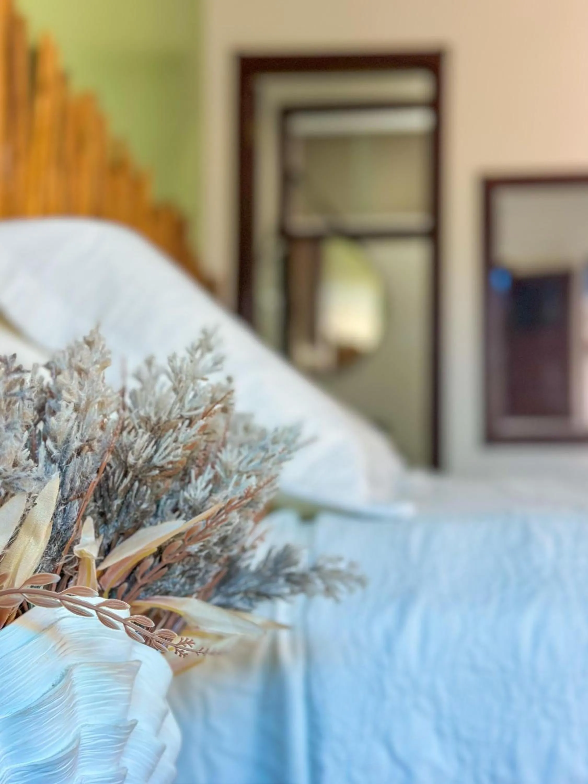 Bed in Pousada Camburi