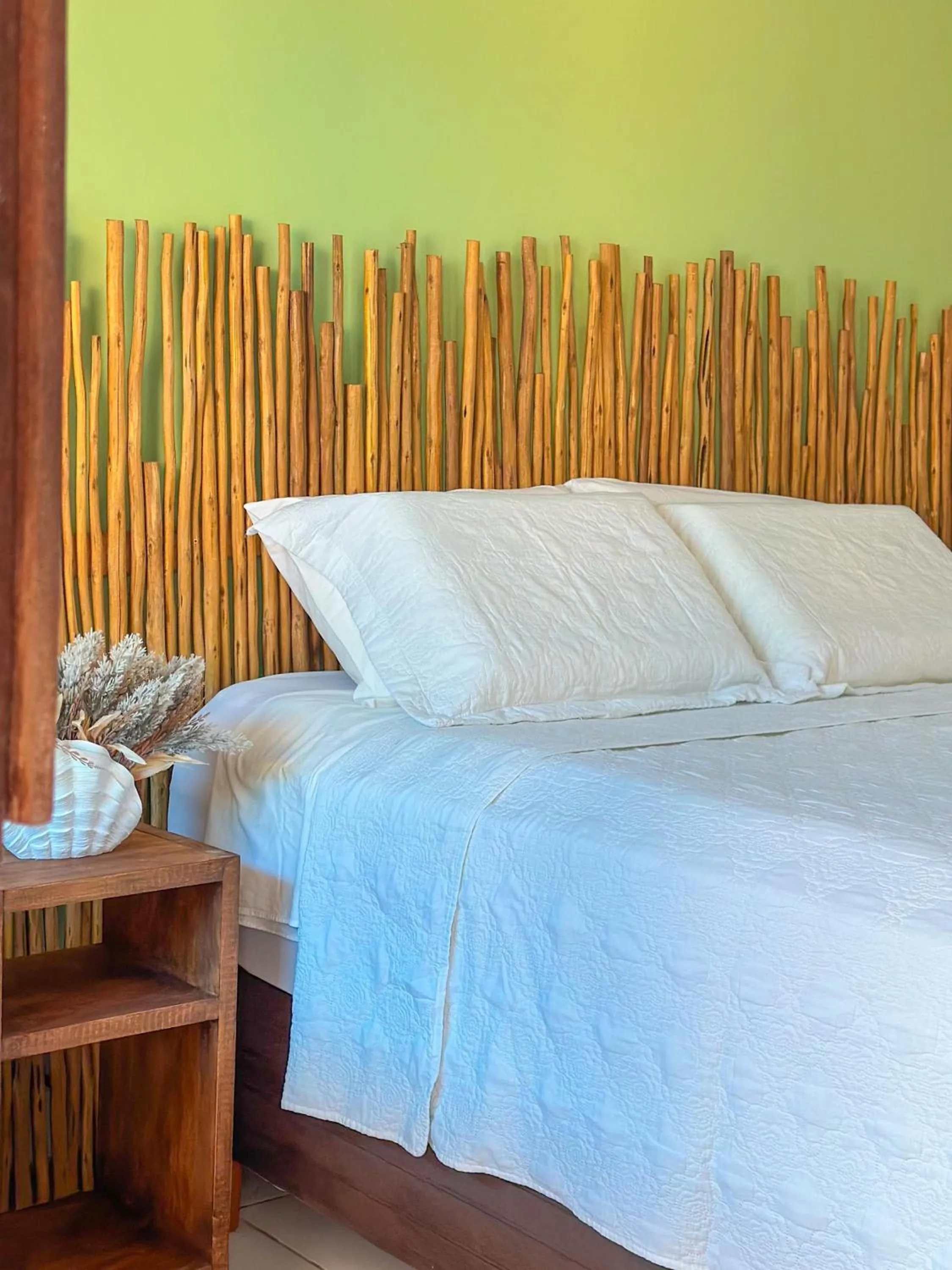 Bed in Pousada Camburi