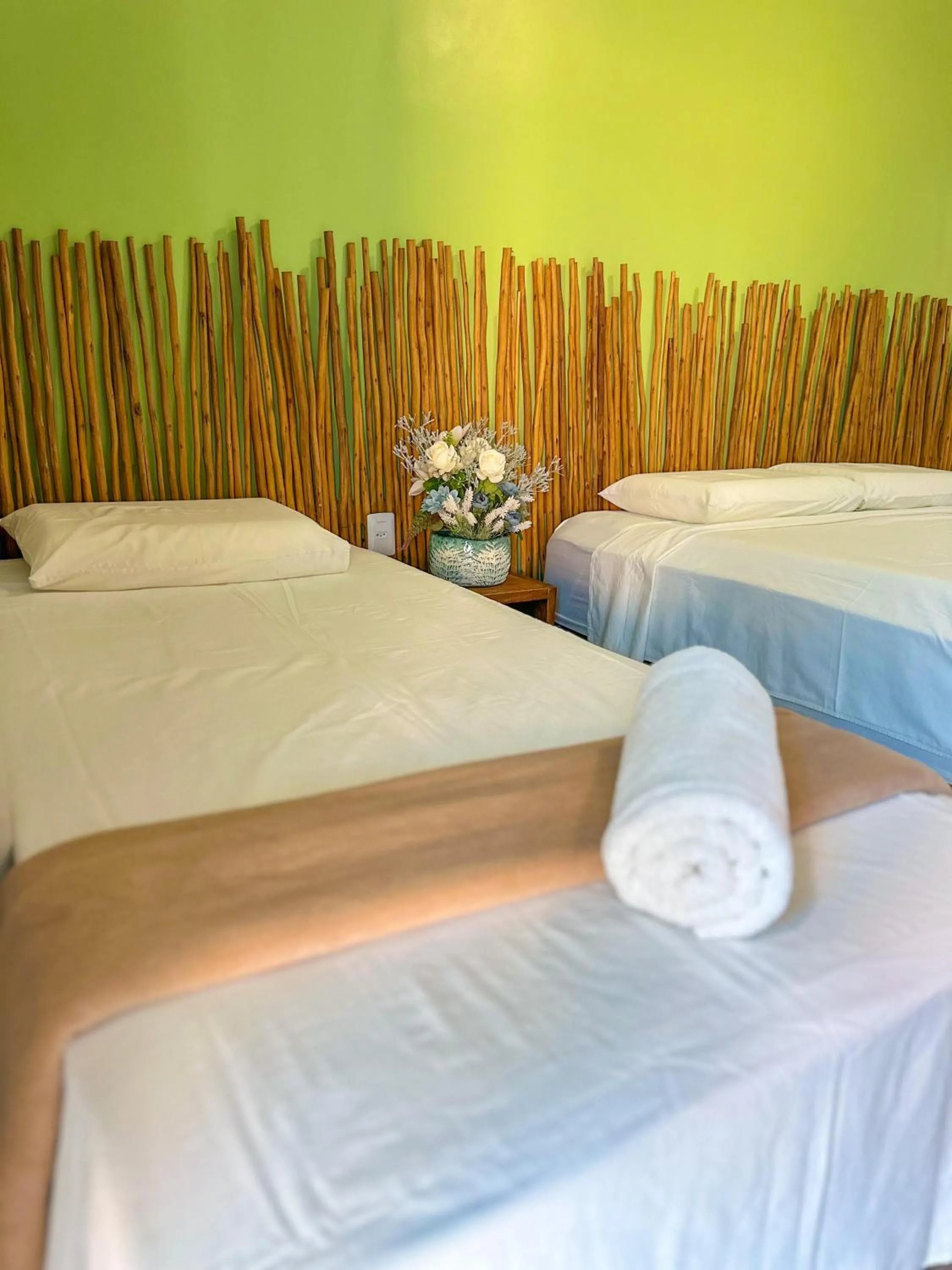 Bed in Pousada Camburi