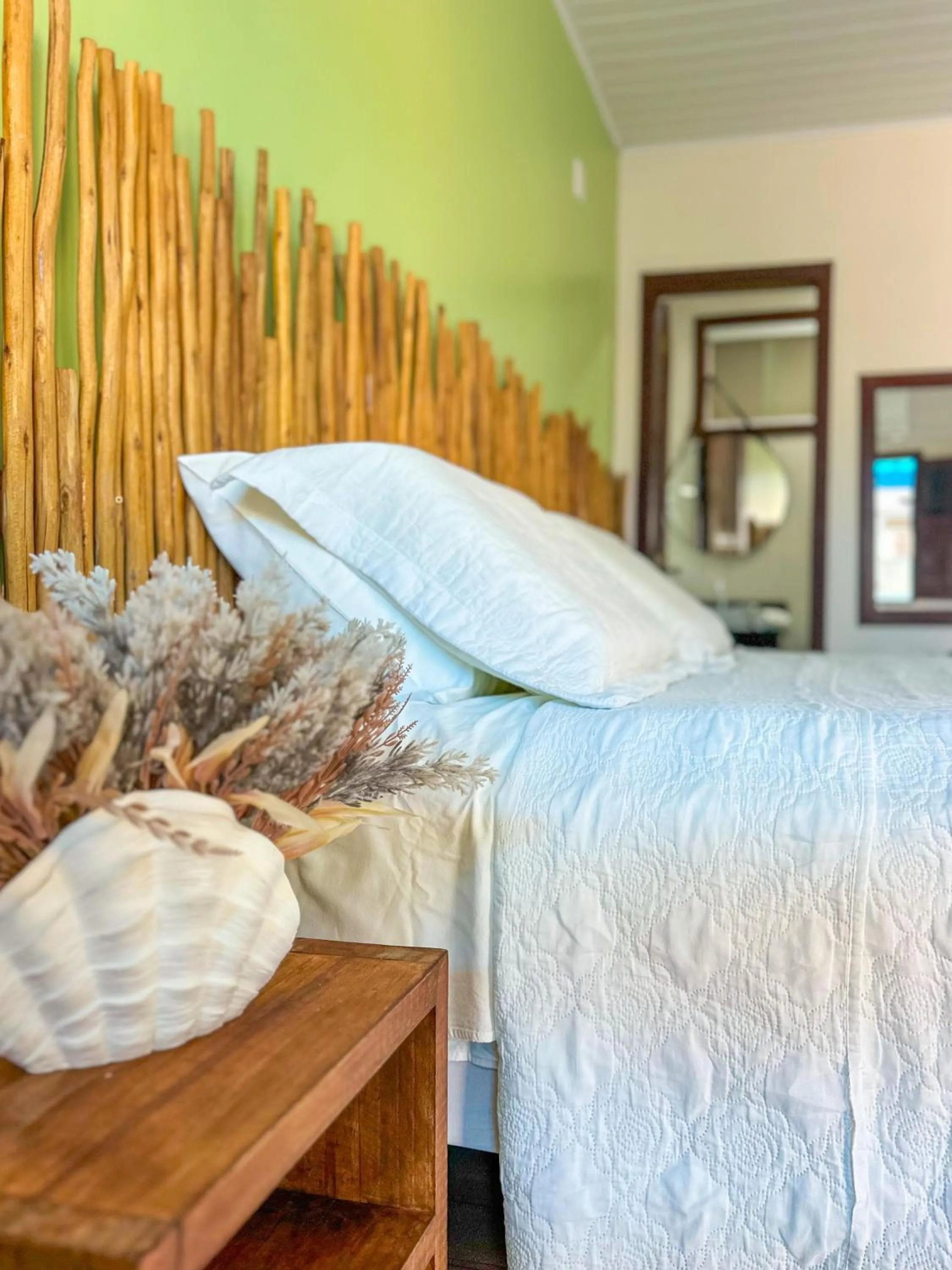Bed in Pousada Camburi