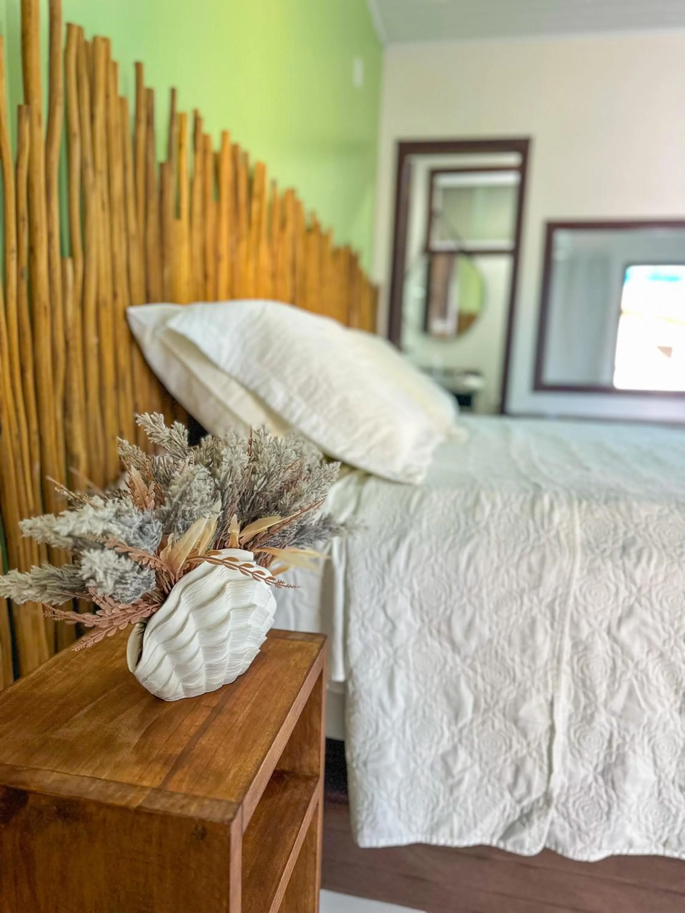 Bed in Pousada Camburi