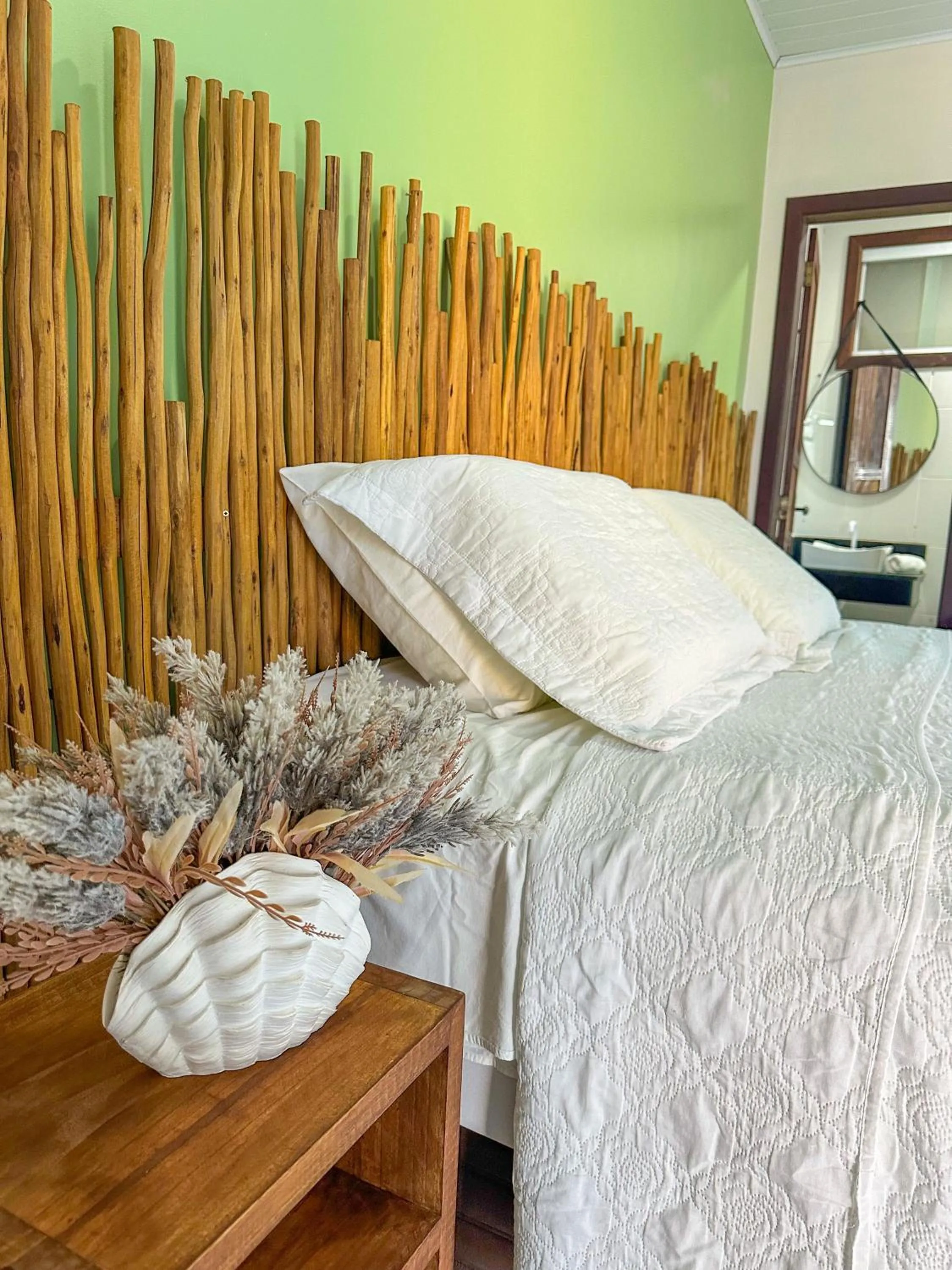 Bed in Pousada Camburi