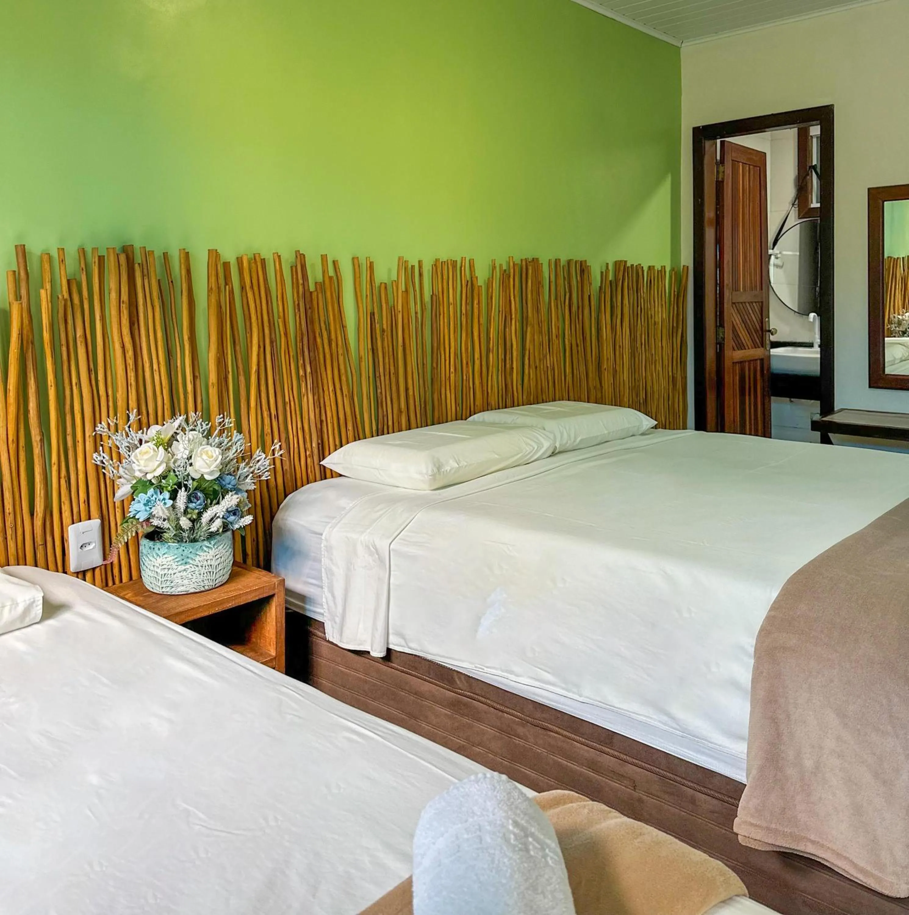 Bed in Pousada Camburi