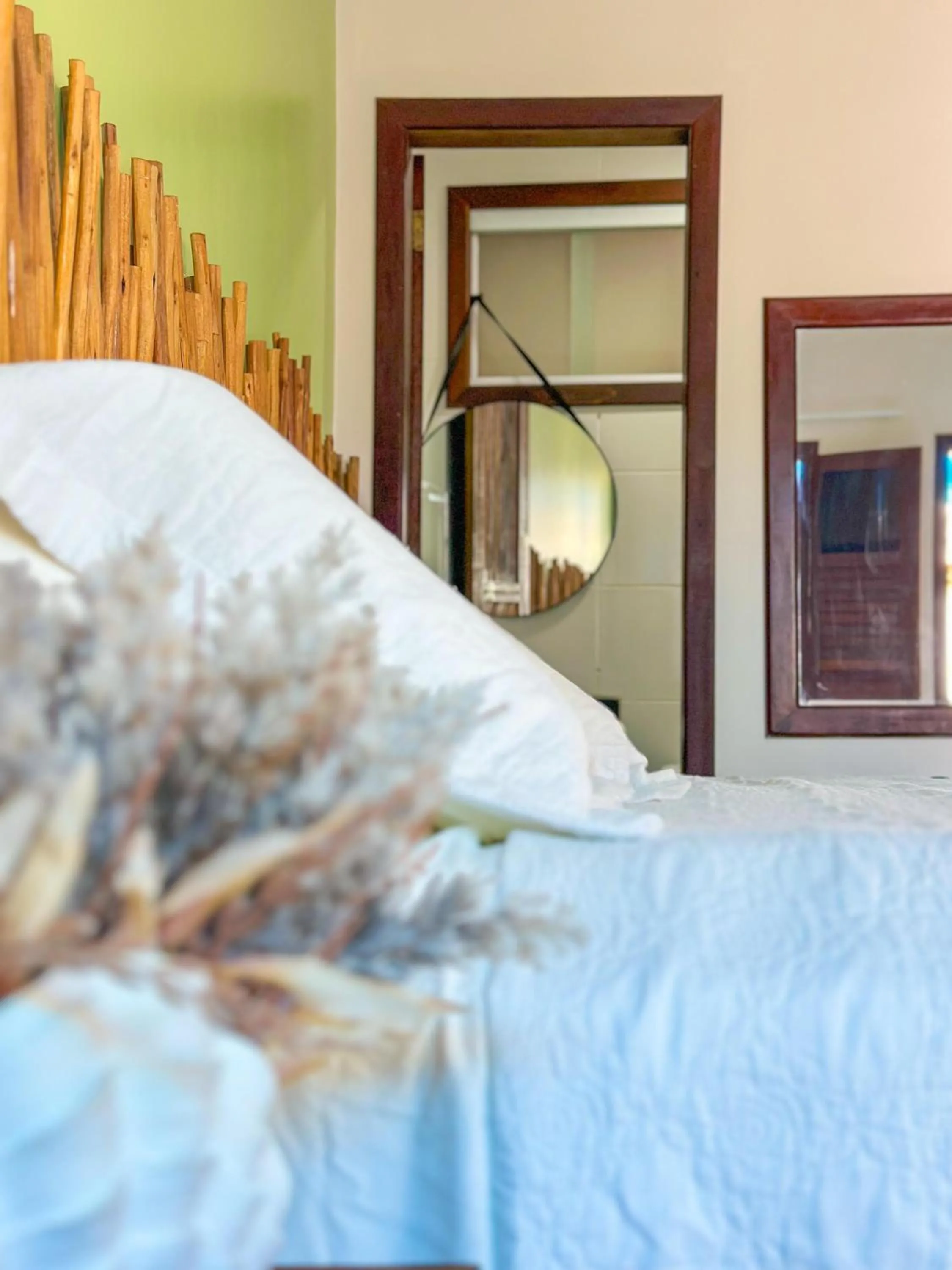 Bed in Pousada Camburi