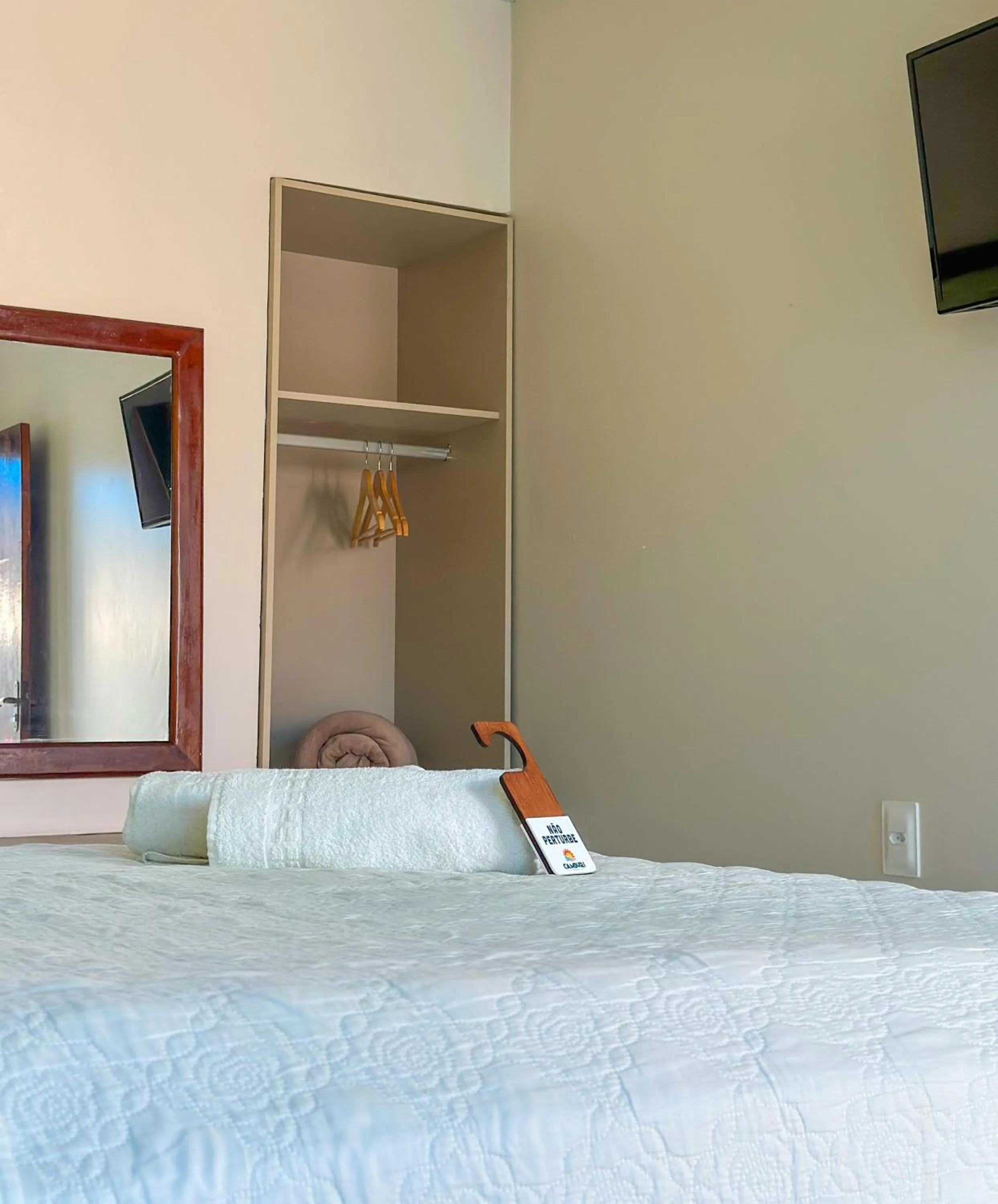 Bed in Pousada Camburi