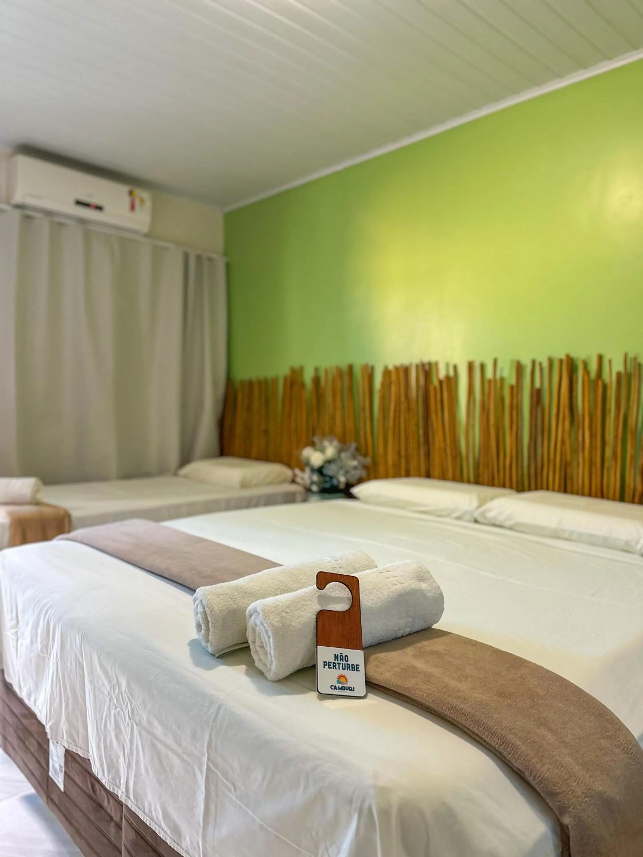 Bed in Pousada Camburi