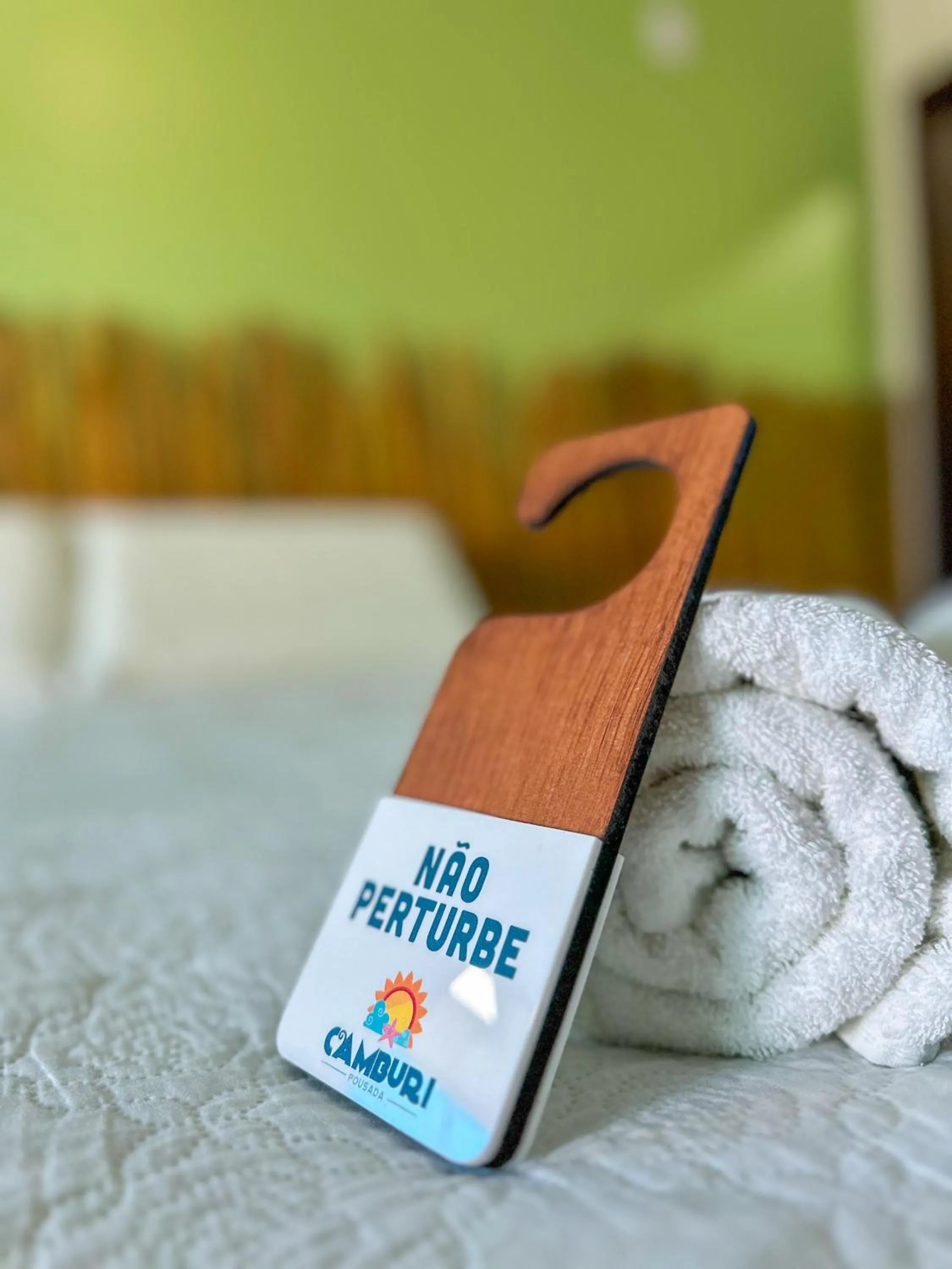 Bed in Pousada Camburi