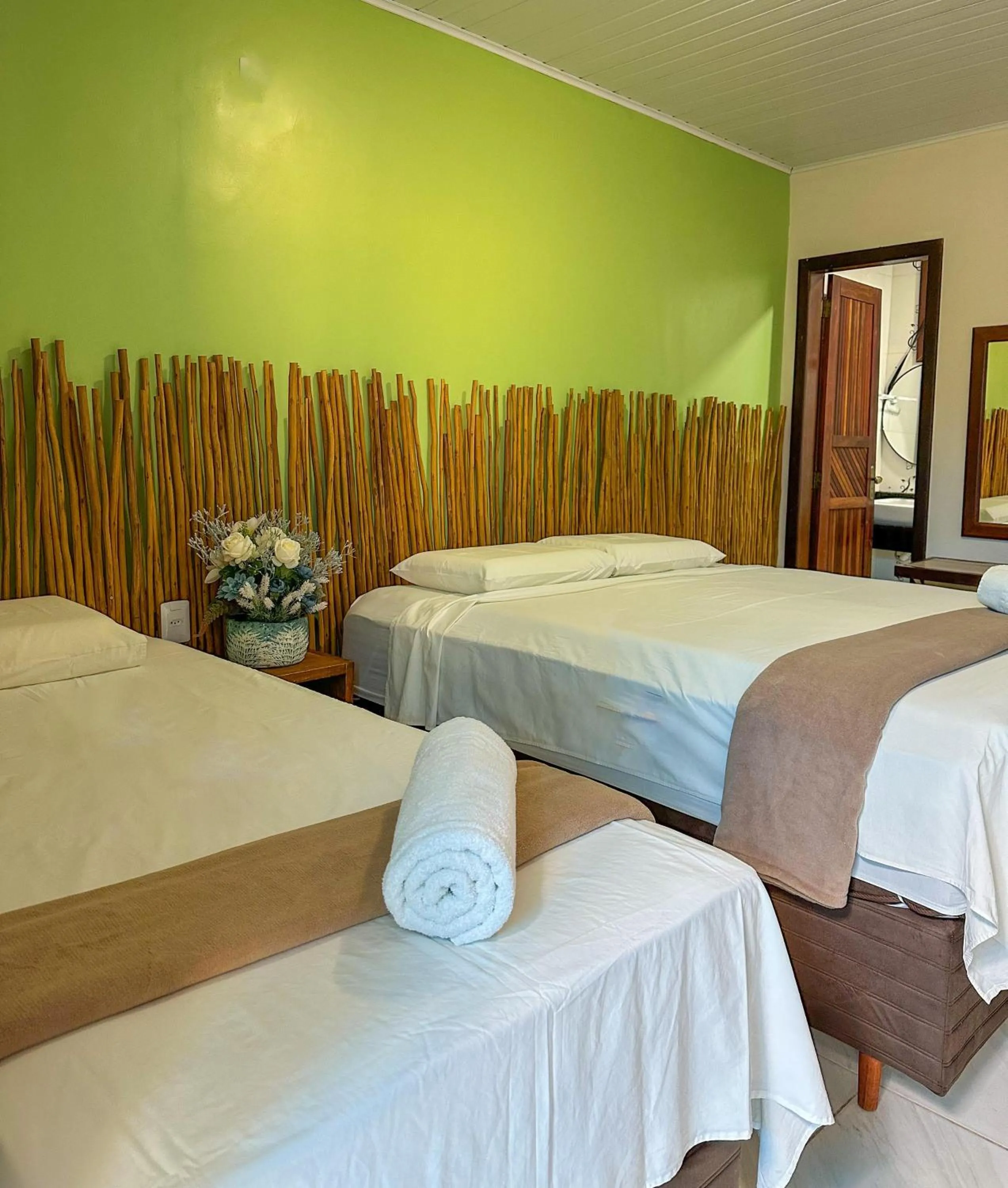 Bed in Pousada Camburi