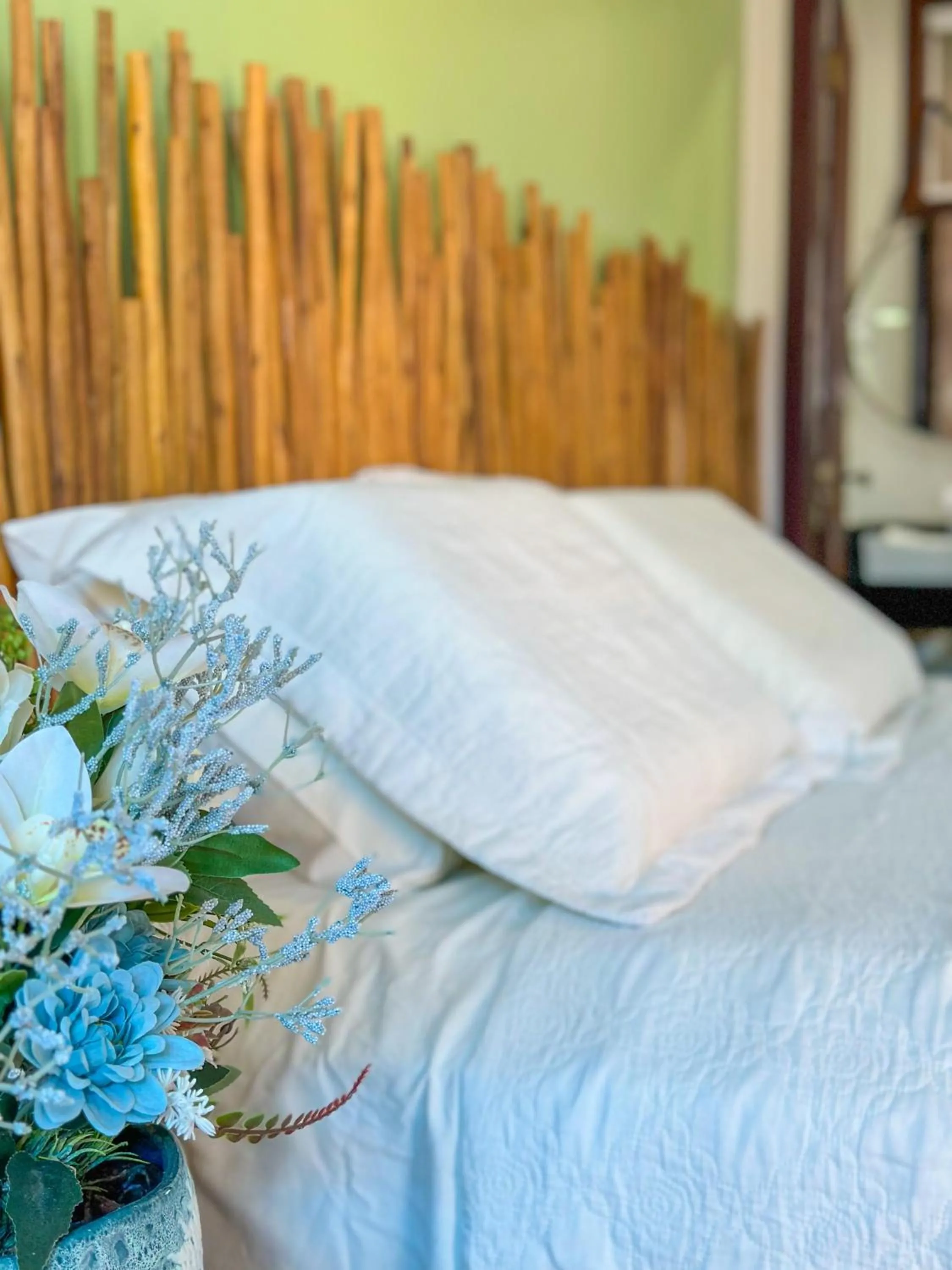Bed in Pousada Camburi