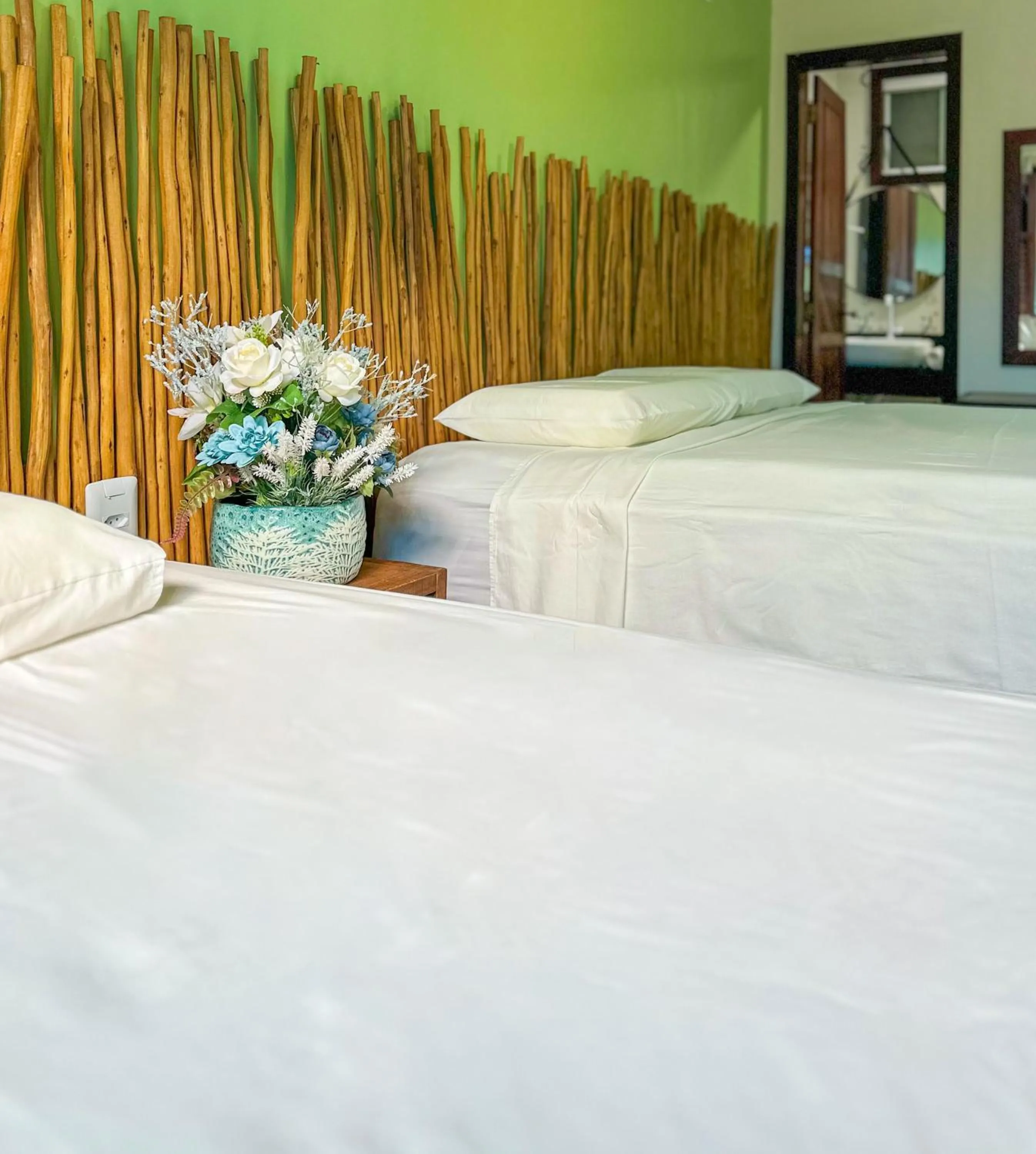 Bed in Pousada Camburi