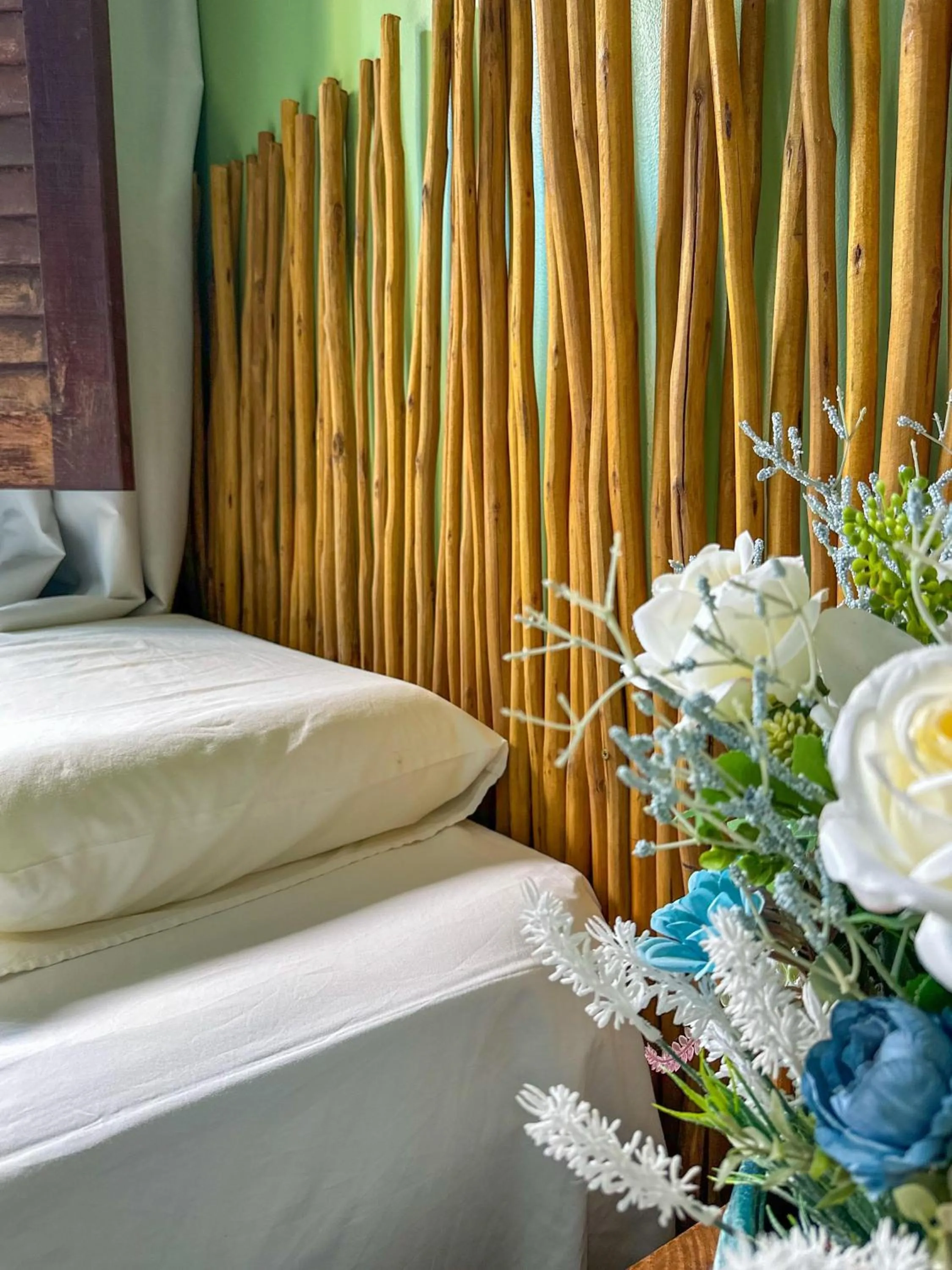 Bed in Pousada Camburi