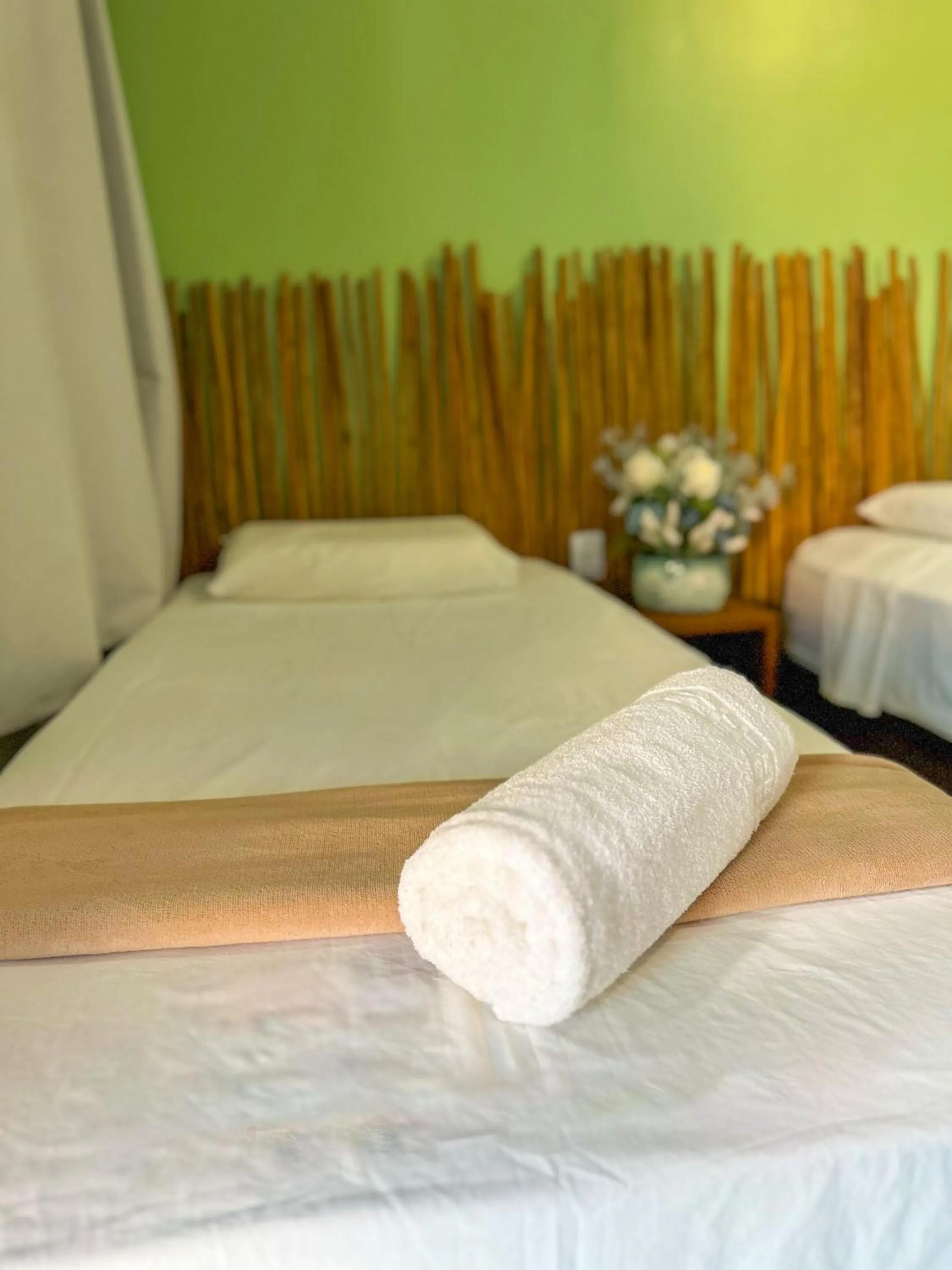 Bed in Pousada Camburi
