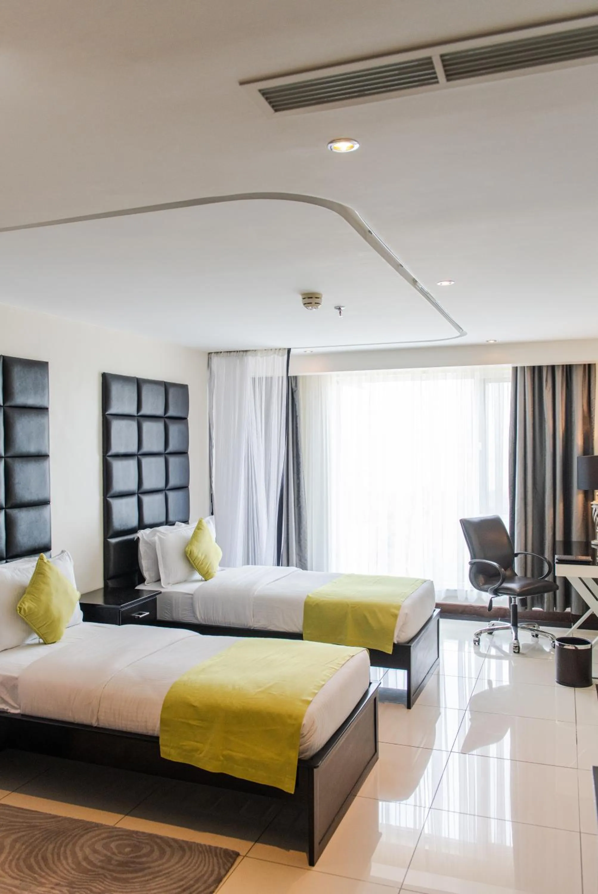 Bed in Acacia Premier Hotel