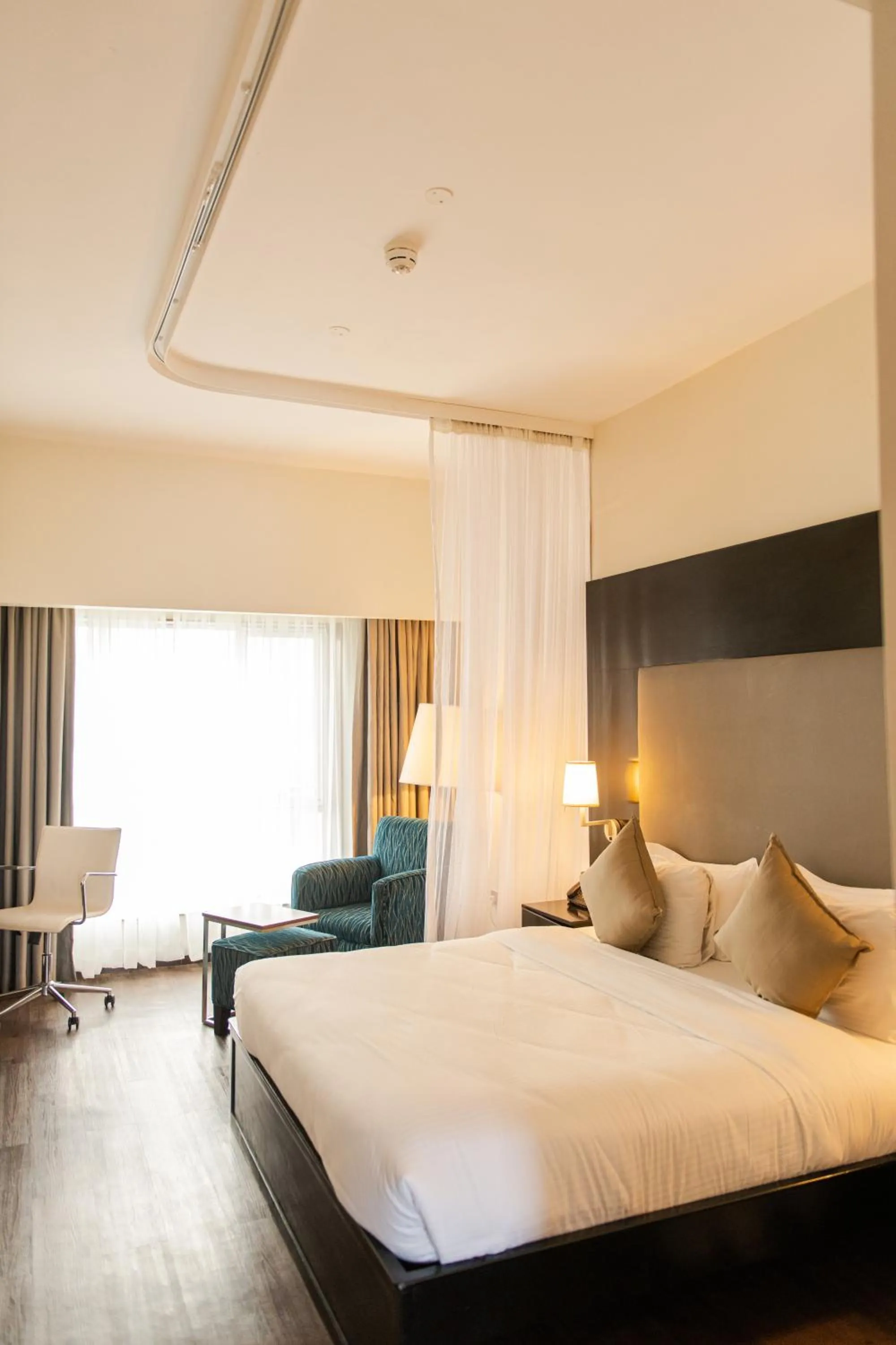 Bed in Acacia Premier Hotel