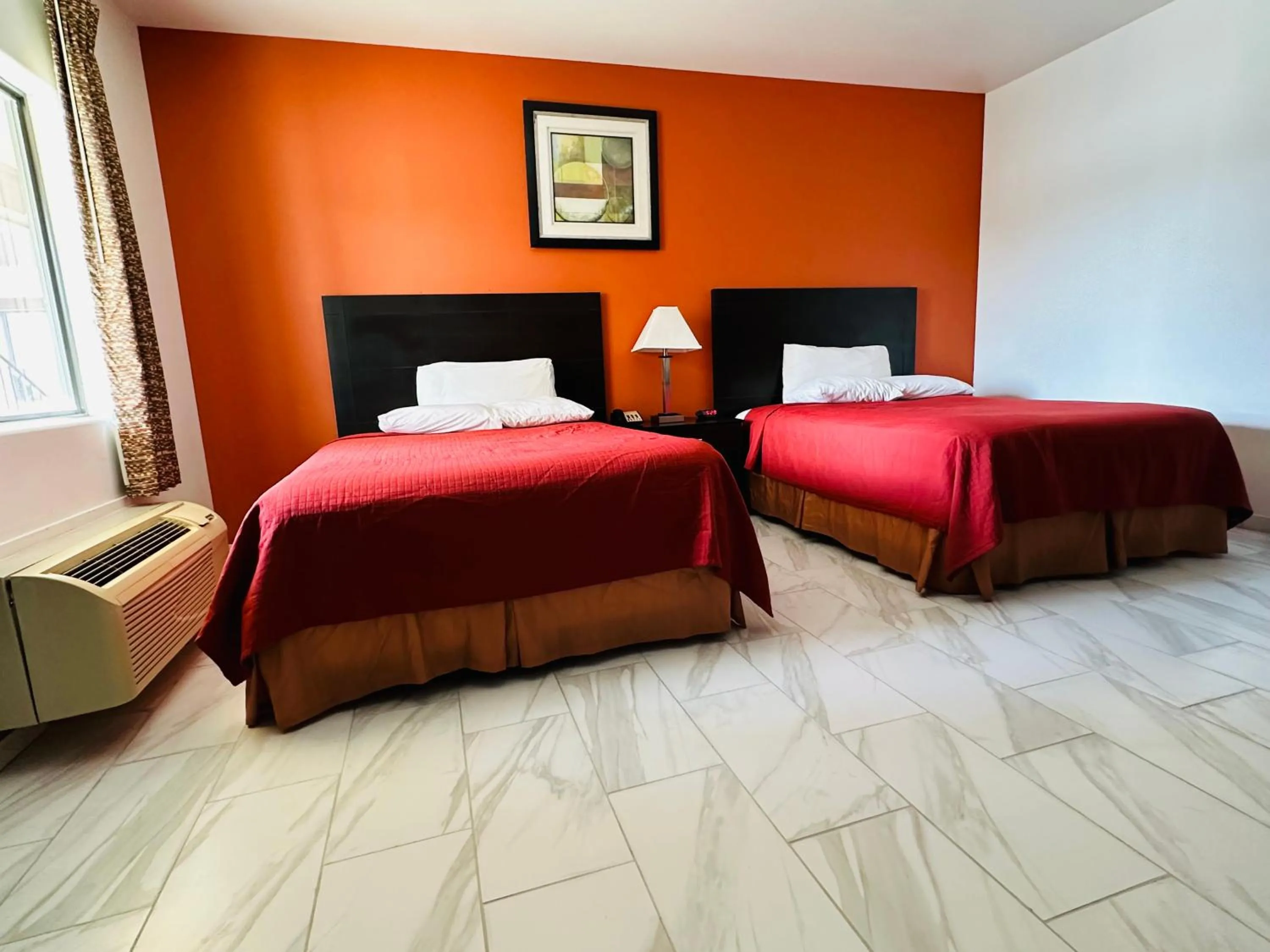 Bed in Lux Inn and Suites