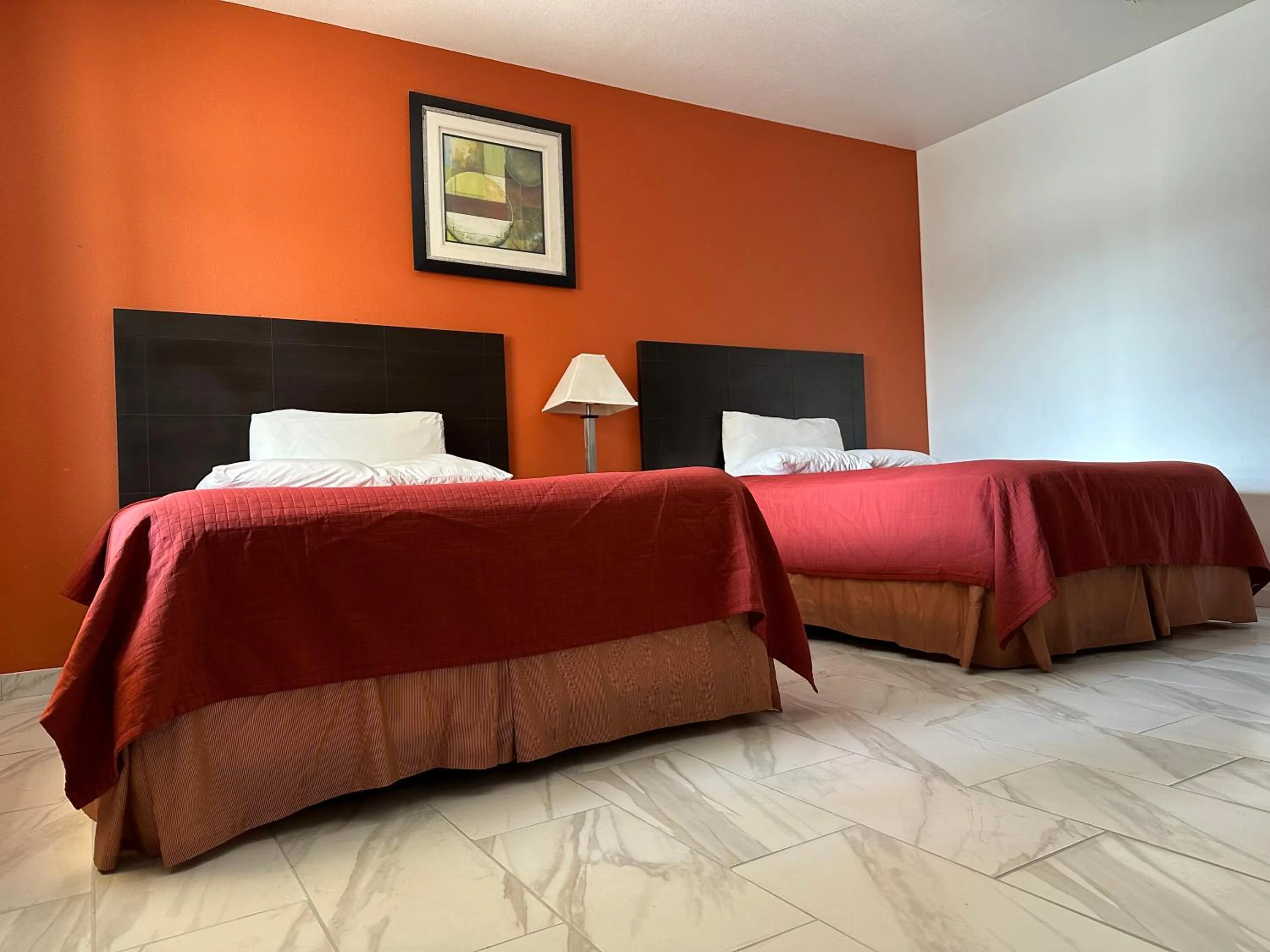 Bed in Lux Inn and Suites