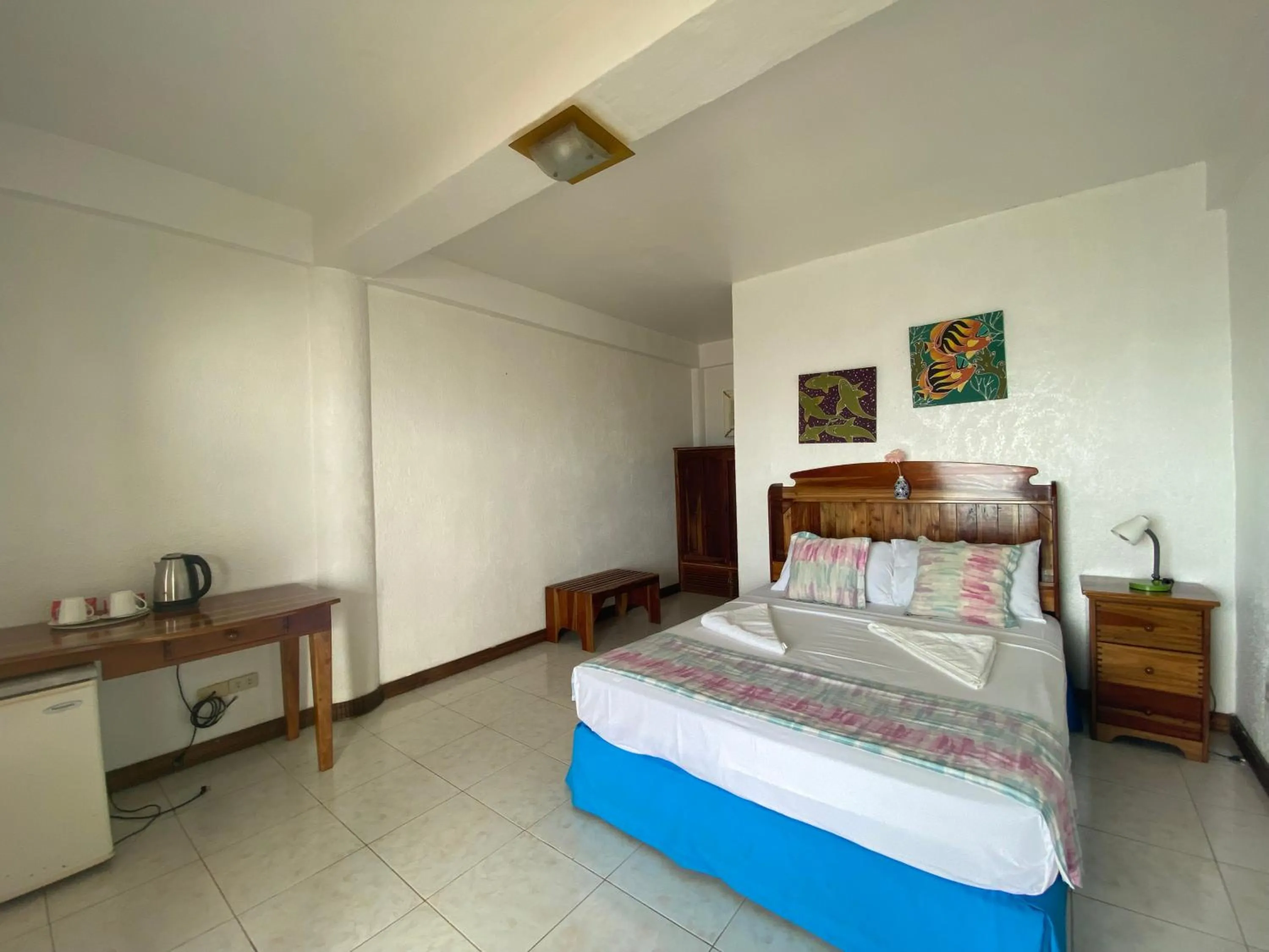 Photo of the whole room, Bed in Camiguin Island Golden Sunset Beach Club