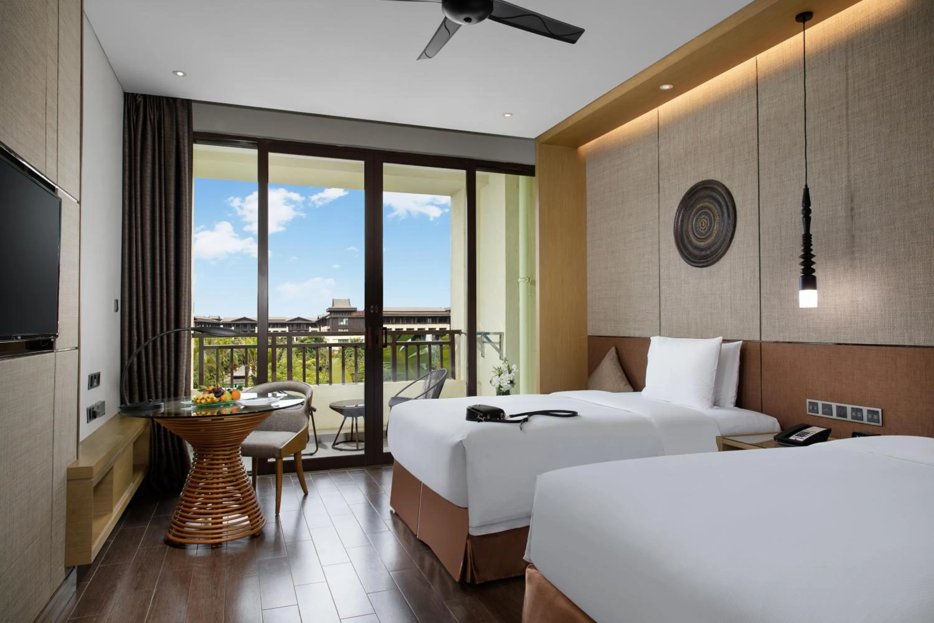 Photo of the whole room, Bed in Pullman Resort Xishuangbanna