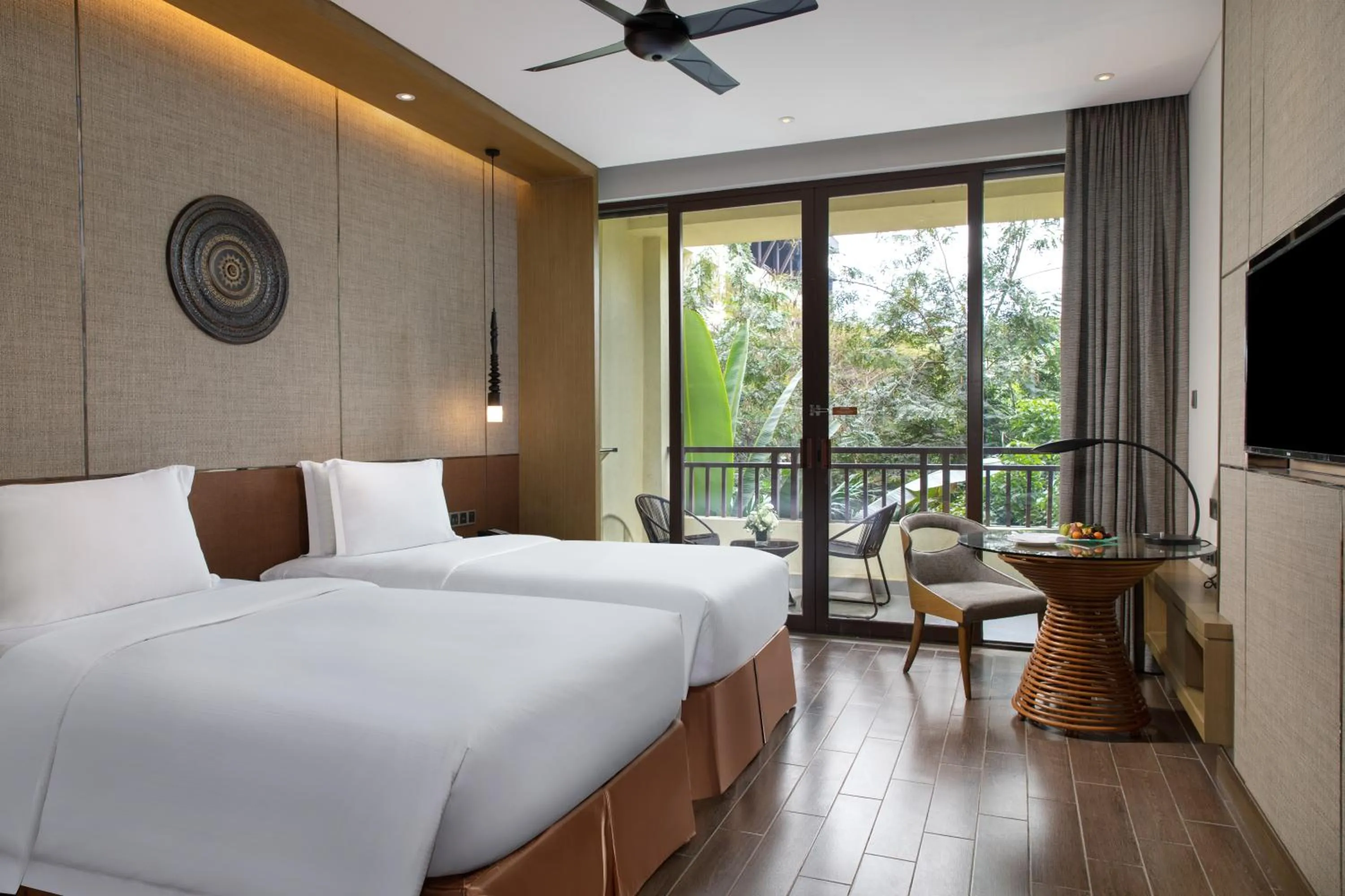 Photo of the whole room, Bed in Pullman Resort Xishuangbanna