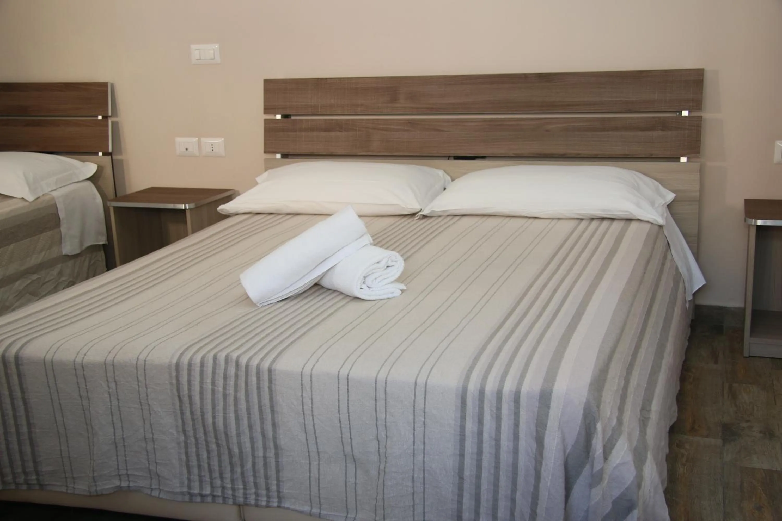 Bed in ChrisMare Hotel