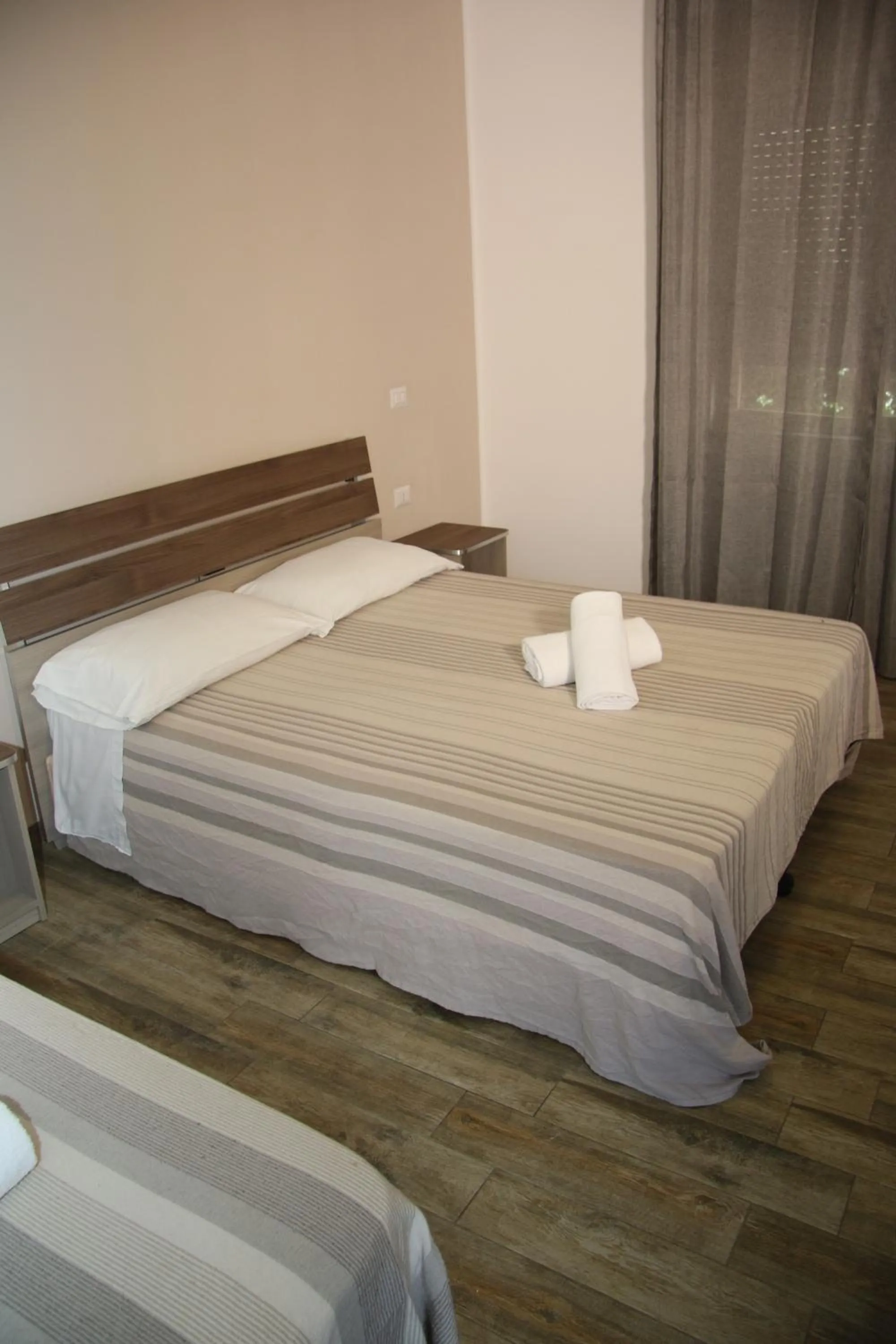 Bed in ChrisMare Hotel