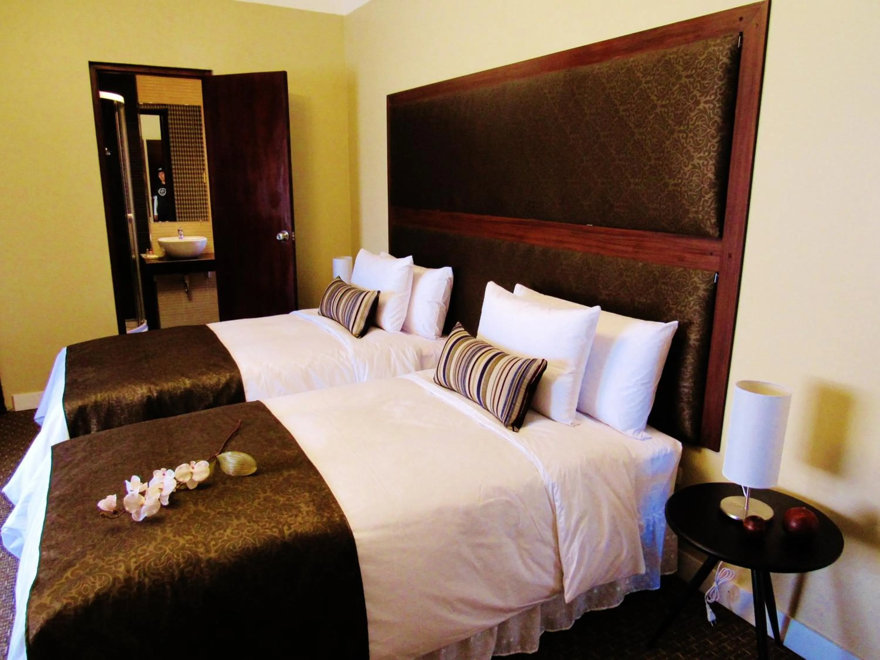 Bed in Los Leones Hotel Boutique