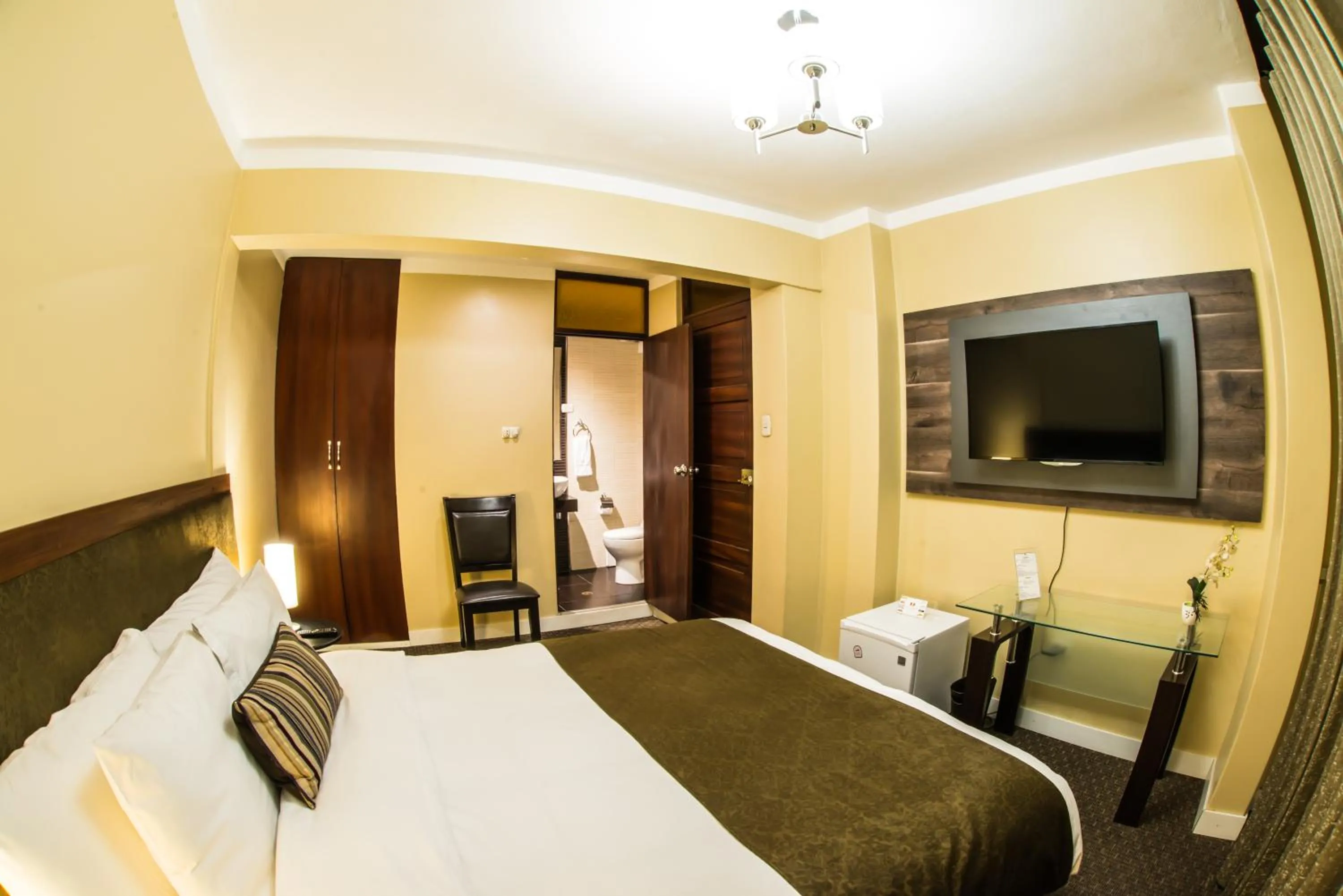 Bed in Los Leones Hotel Boutique