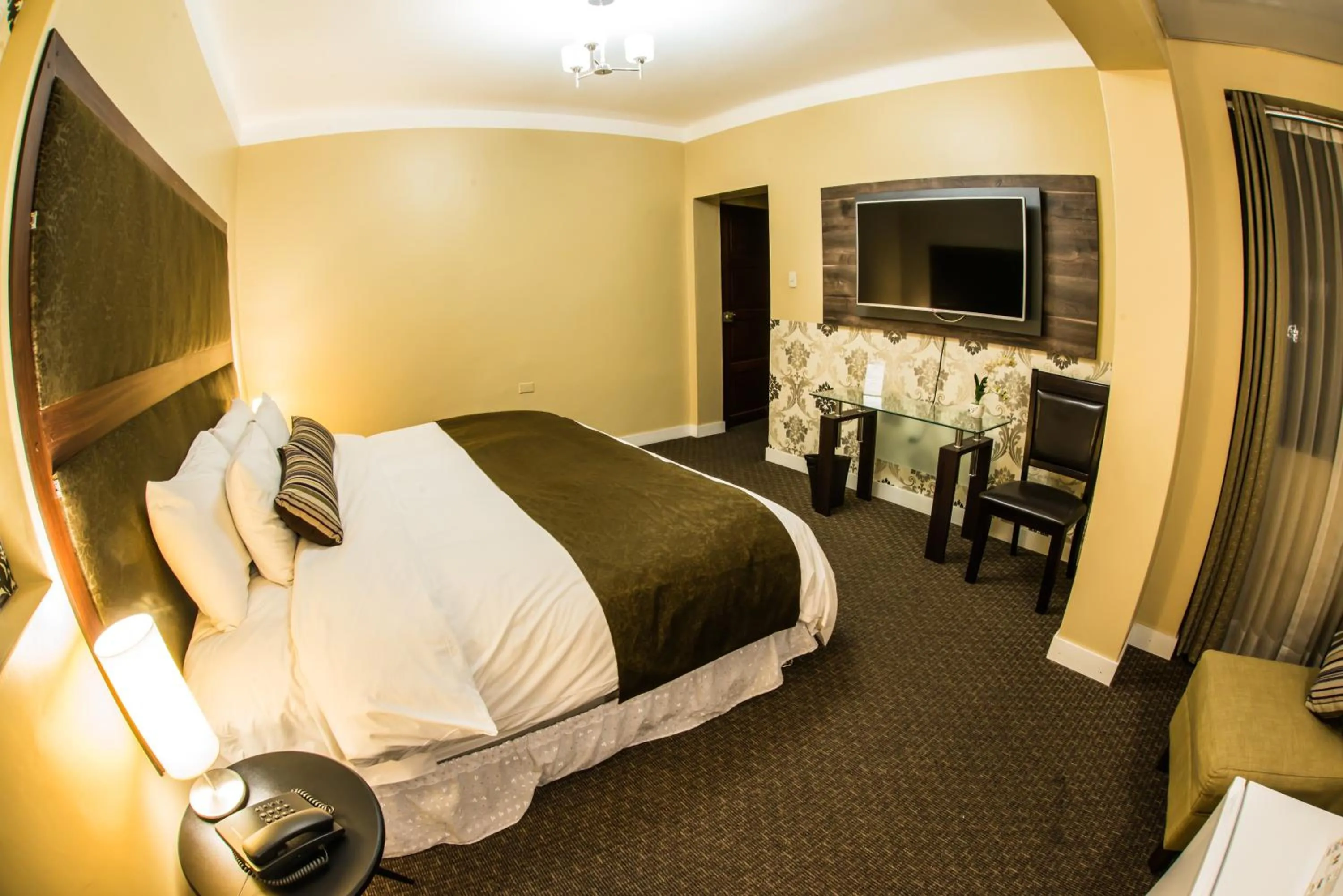 Bed in Los Leones Hotel Boutique