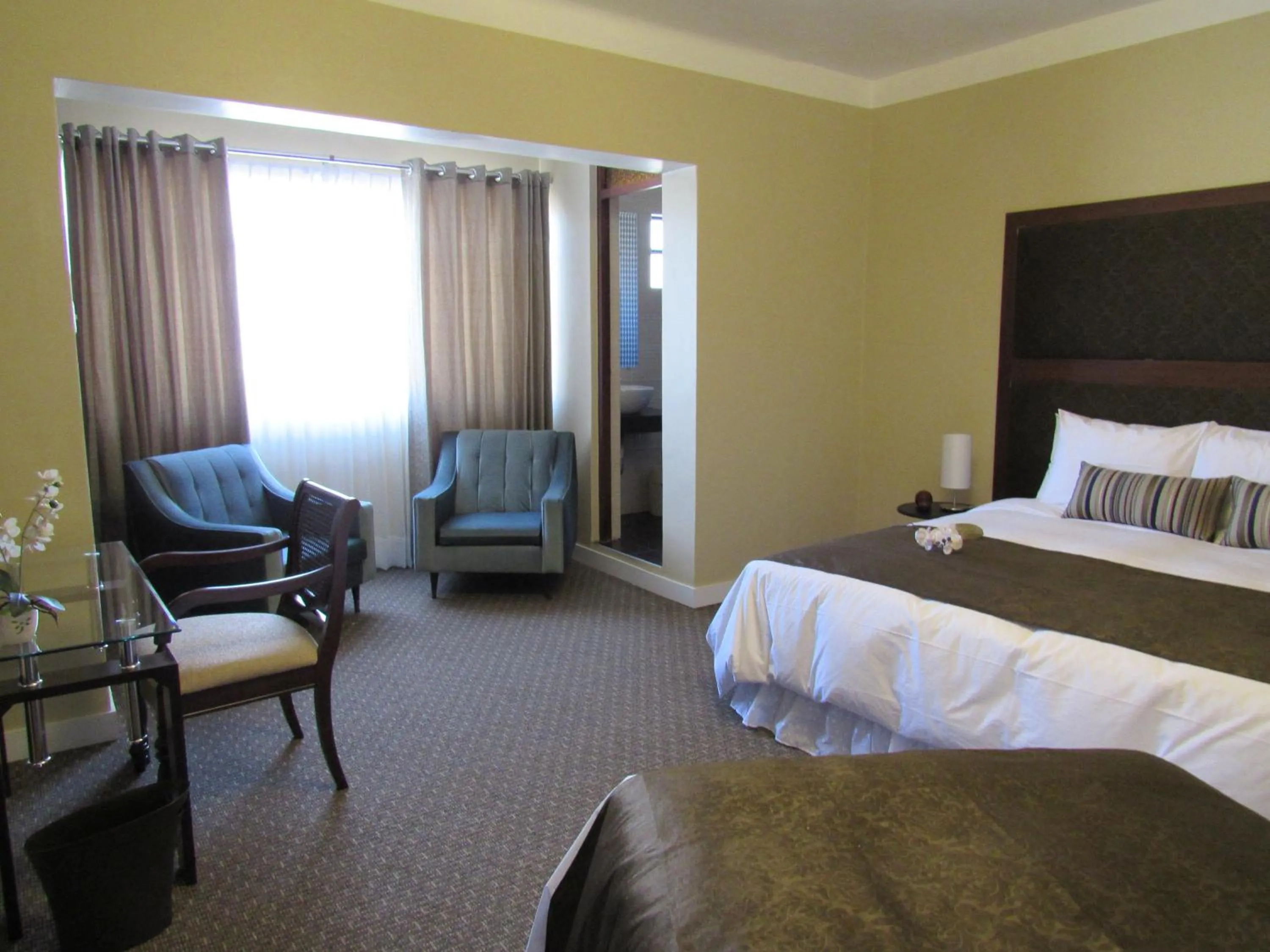 Bed in Los Leones Hotel Boutique