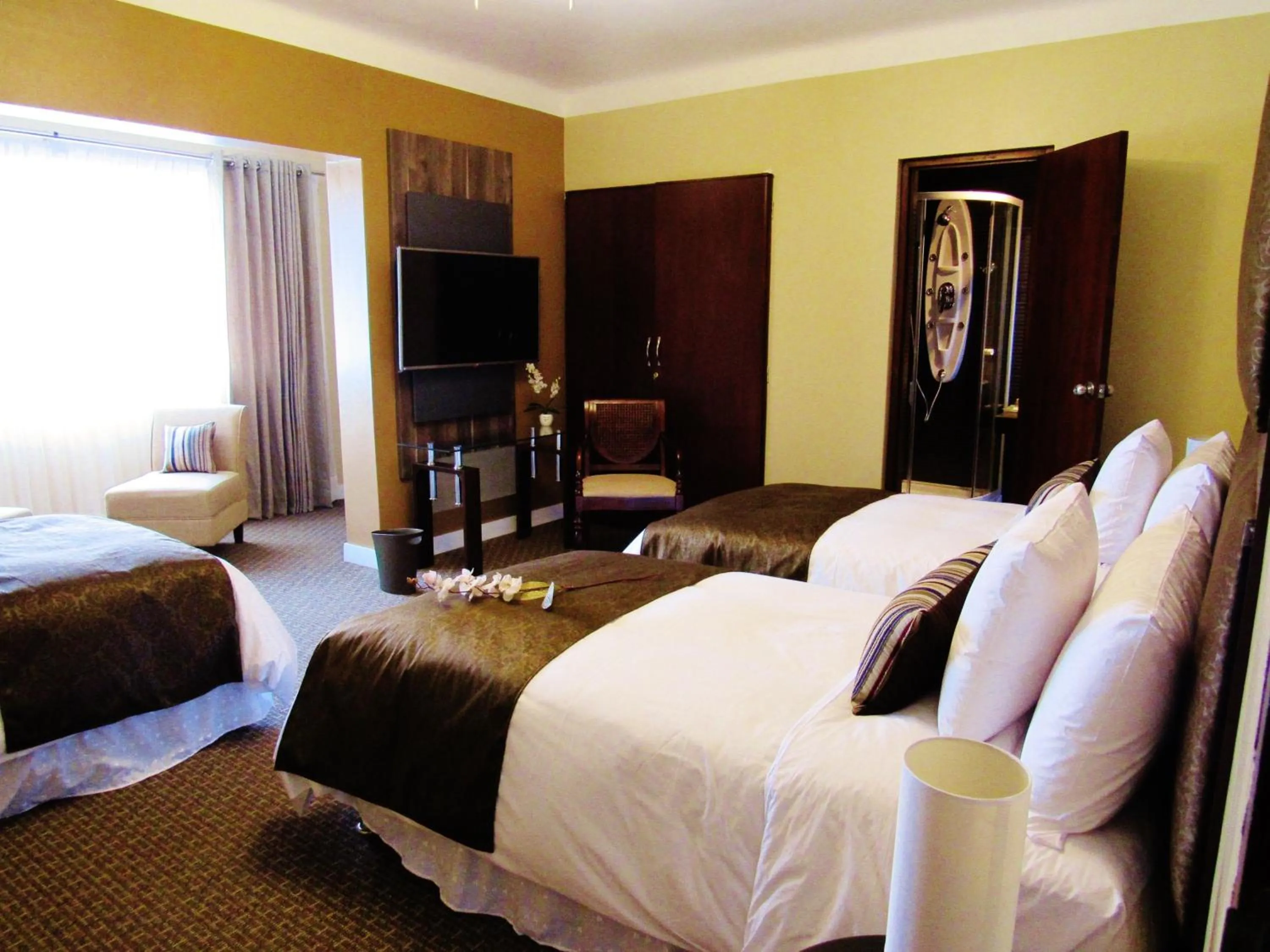 Bed in Los Leones Hotel Boutique