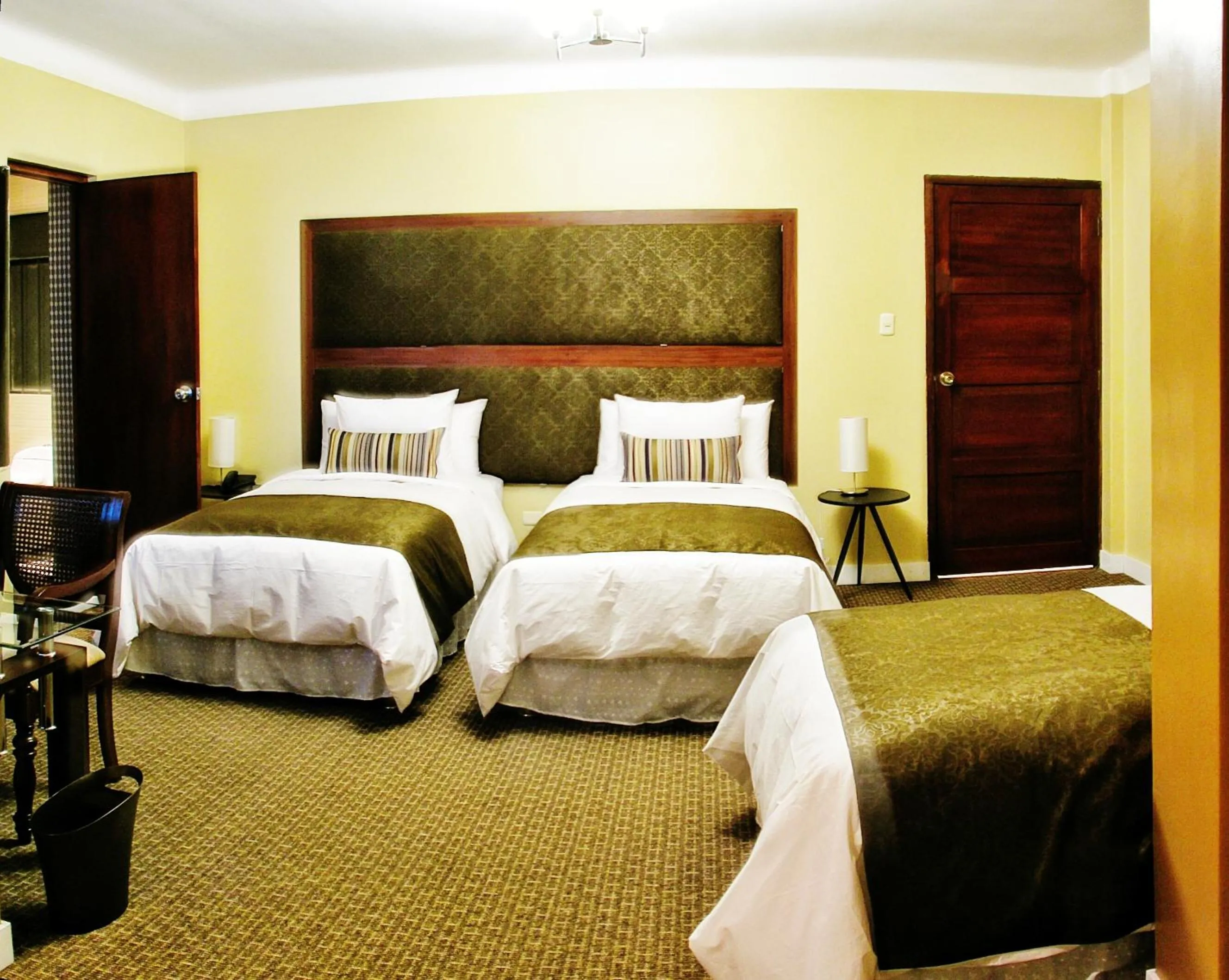 Bed in Los Leones Hotel Boutique