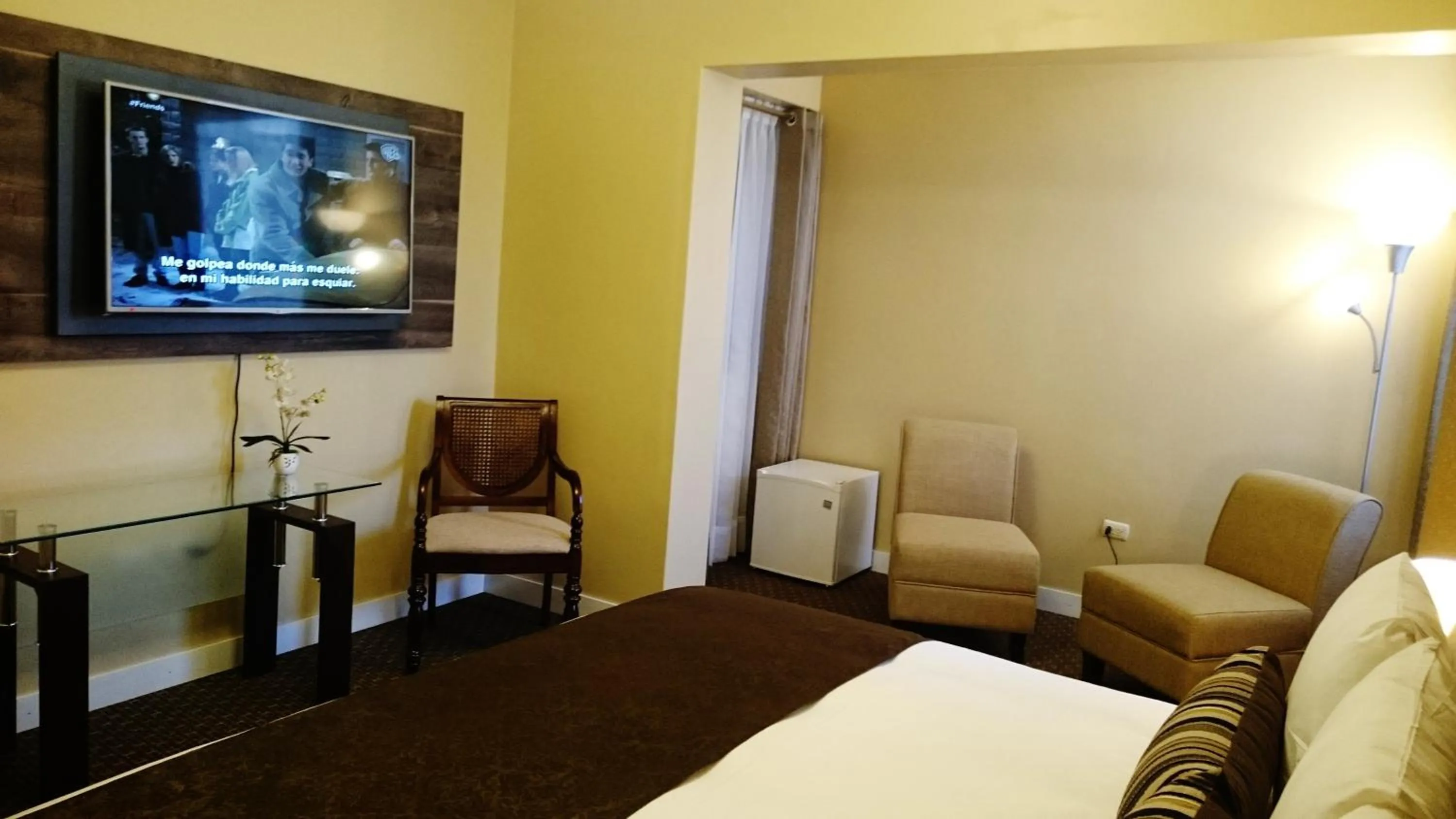 Bed in Los Leones Hotel Boutique