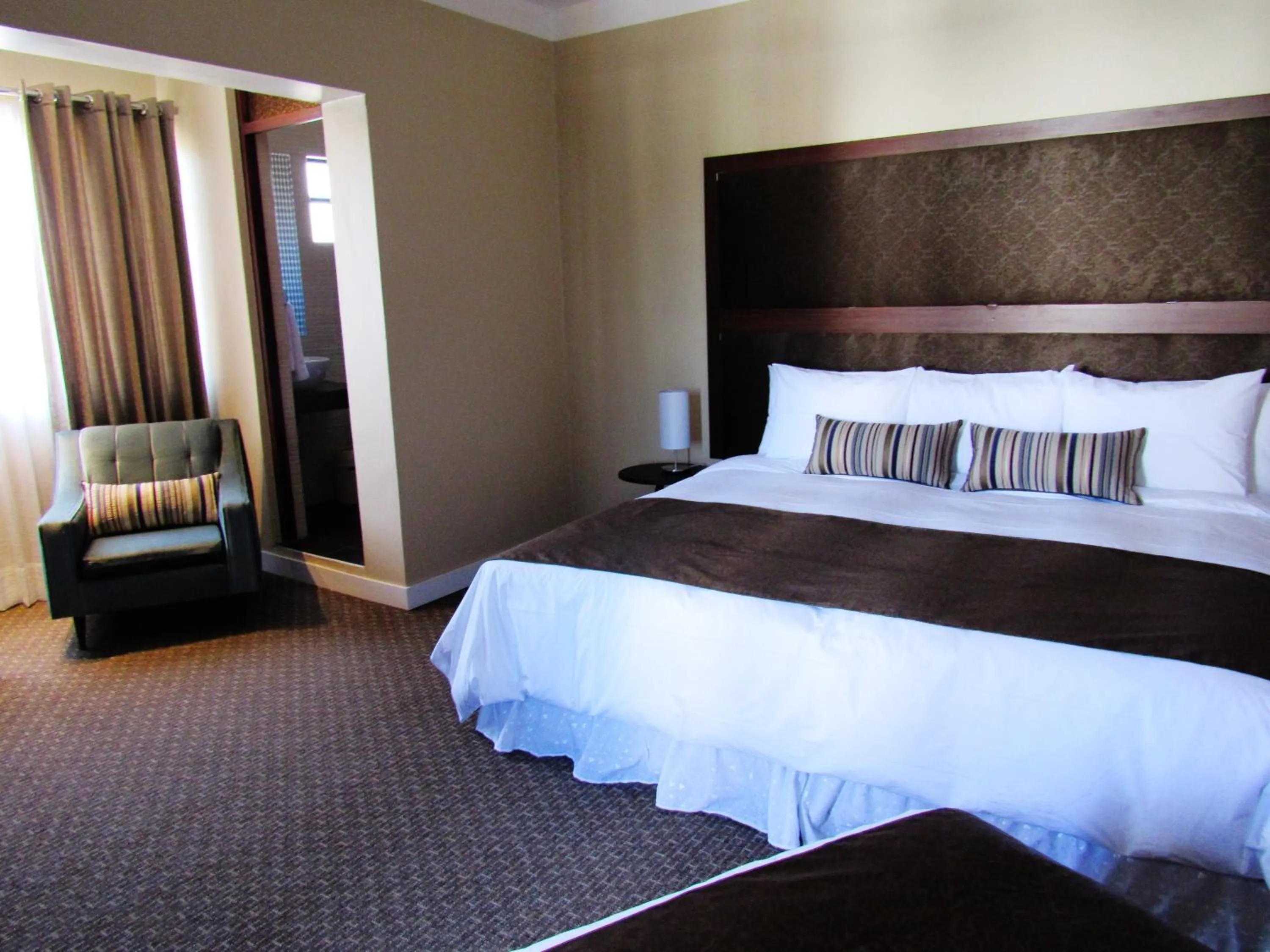 Bed in Los Leones Hotel Boutique