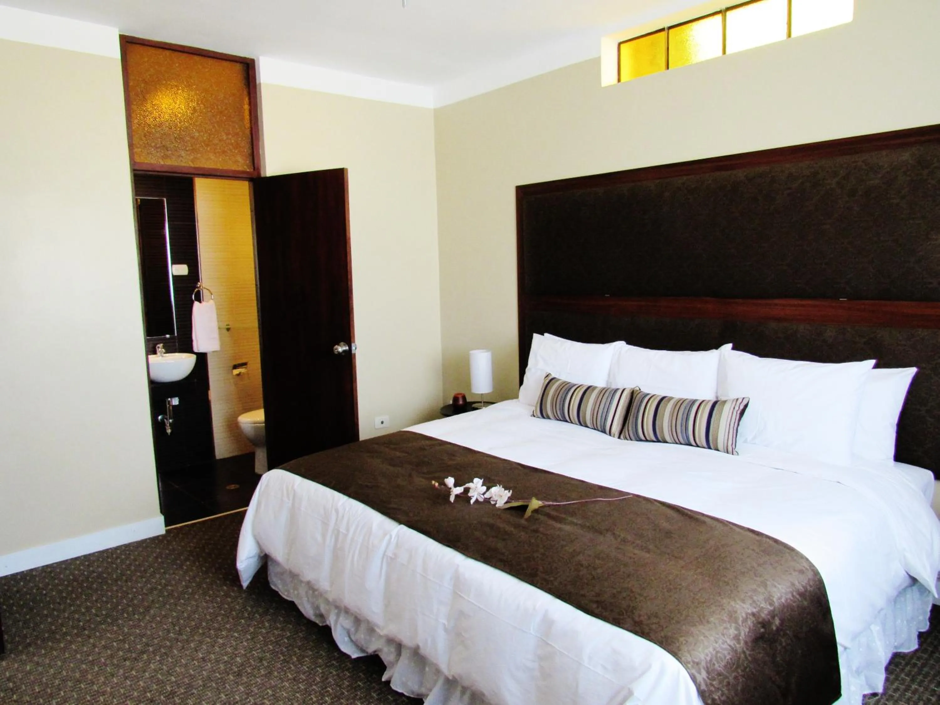 Bed in Los Leones Hotel Boutique