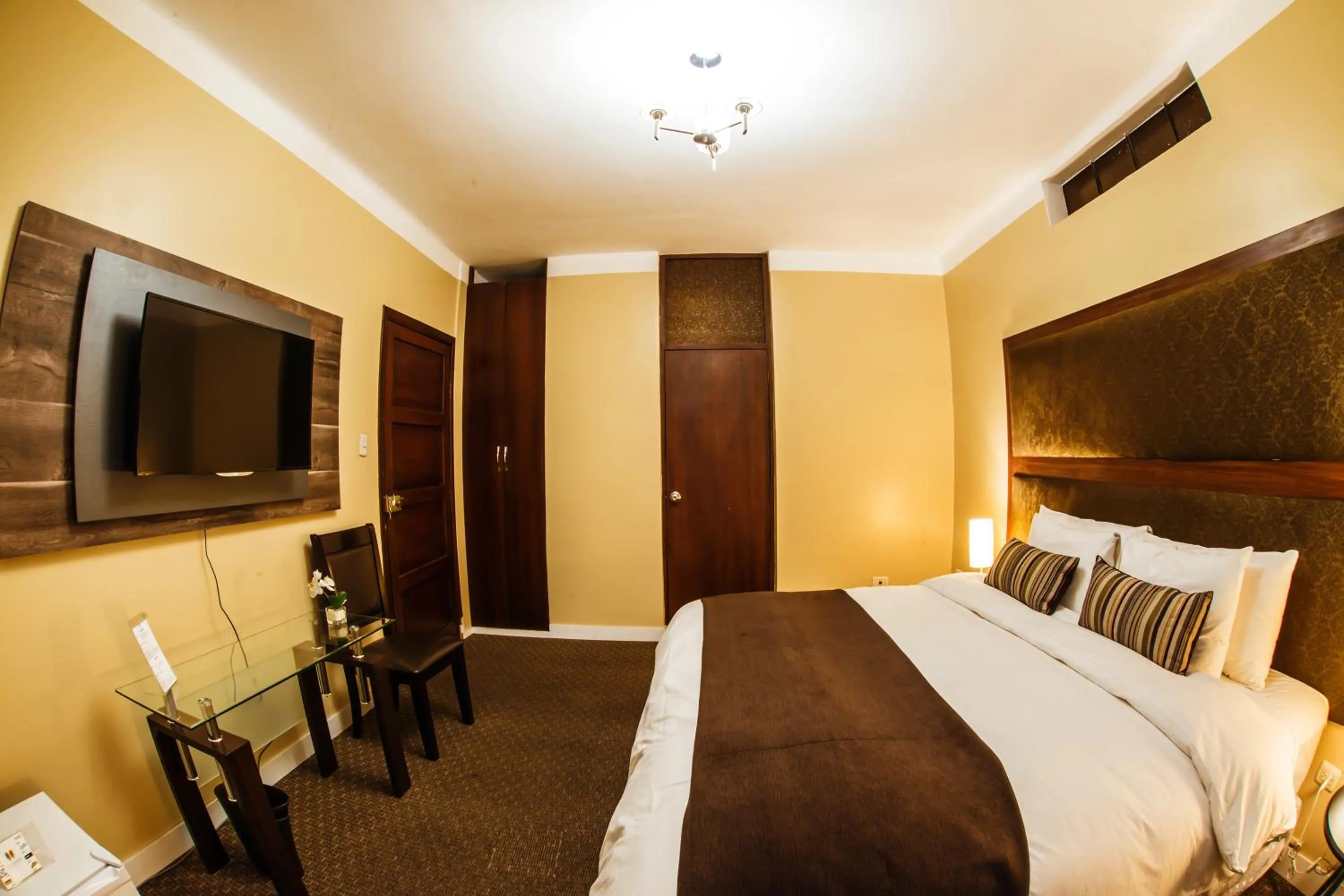 Bed in Los Leones Hotel Boutique