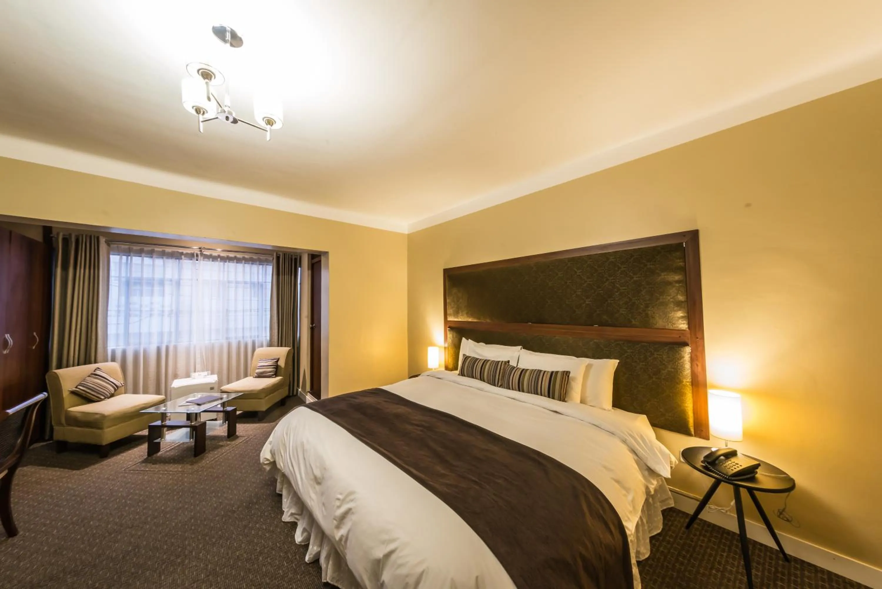 Bed in Los Leones Hotel Boutique