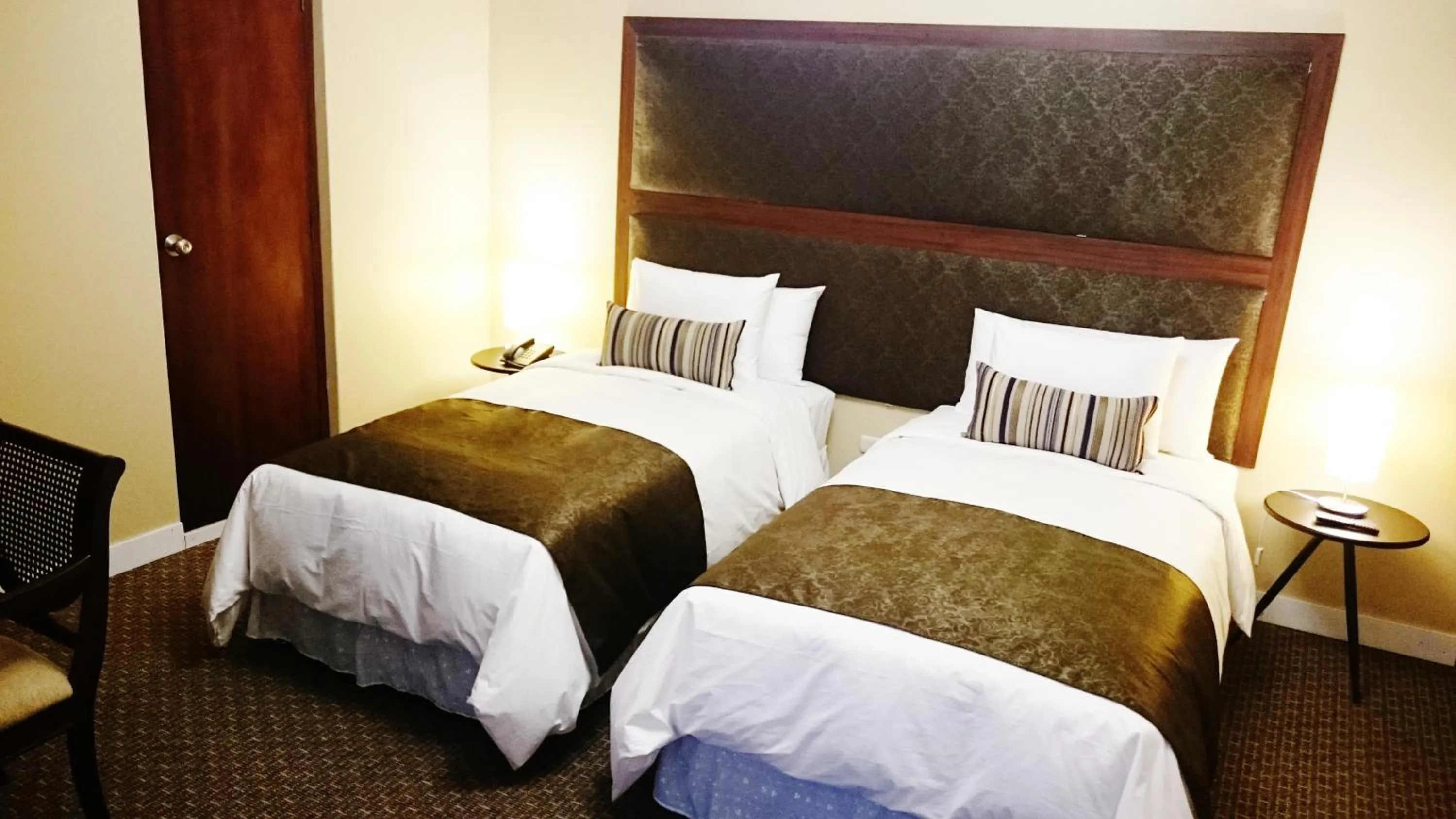 Bed in Los Leones Hotel Boutique
