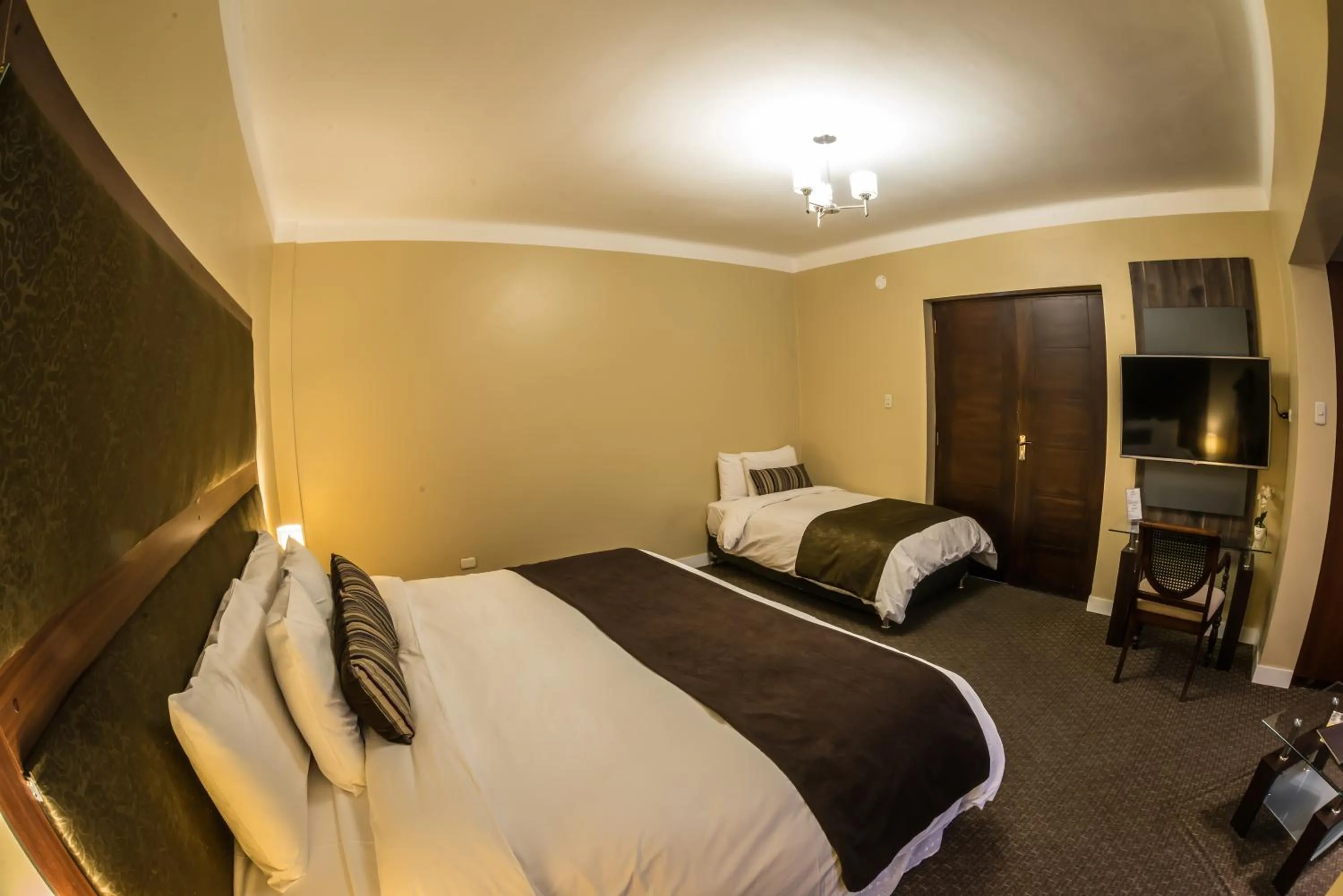 Bed in Los Leones Hotel Boutique