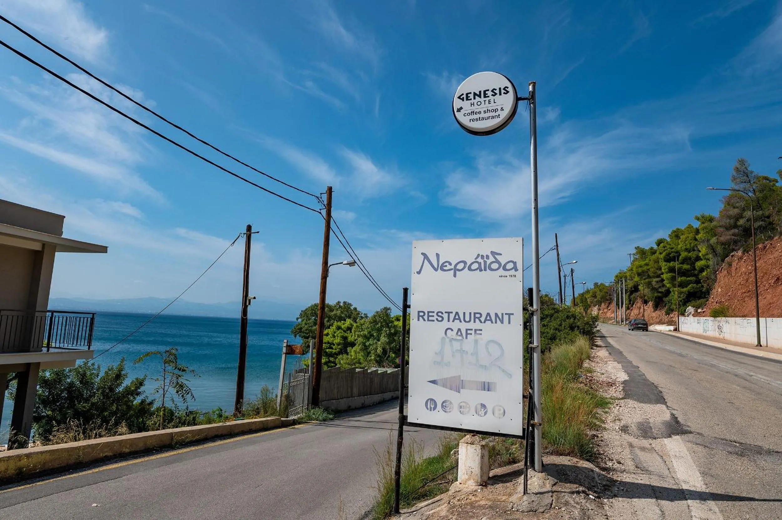 Property logo or sign in Genesis Hotel