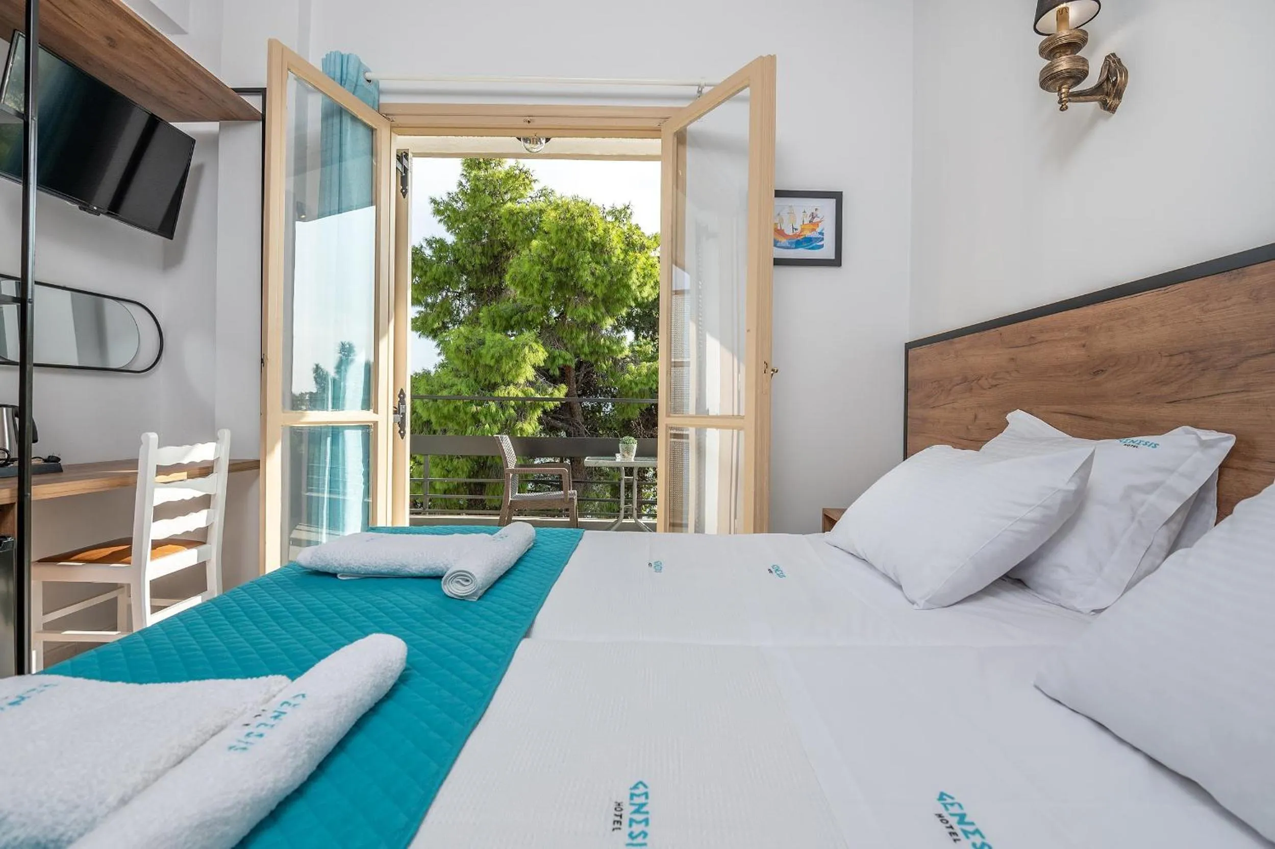 Bed in Genesis Hotel