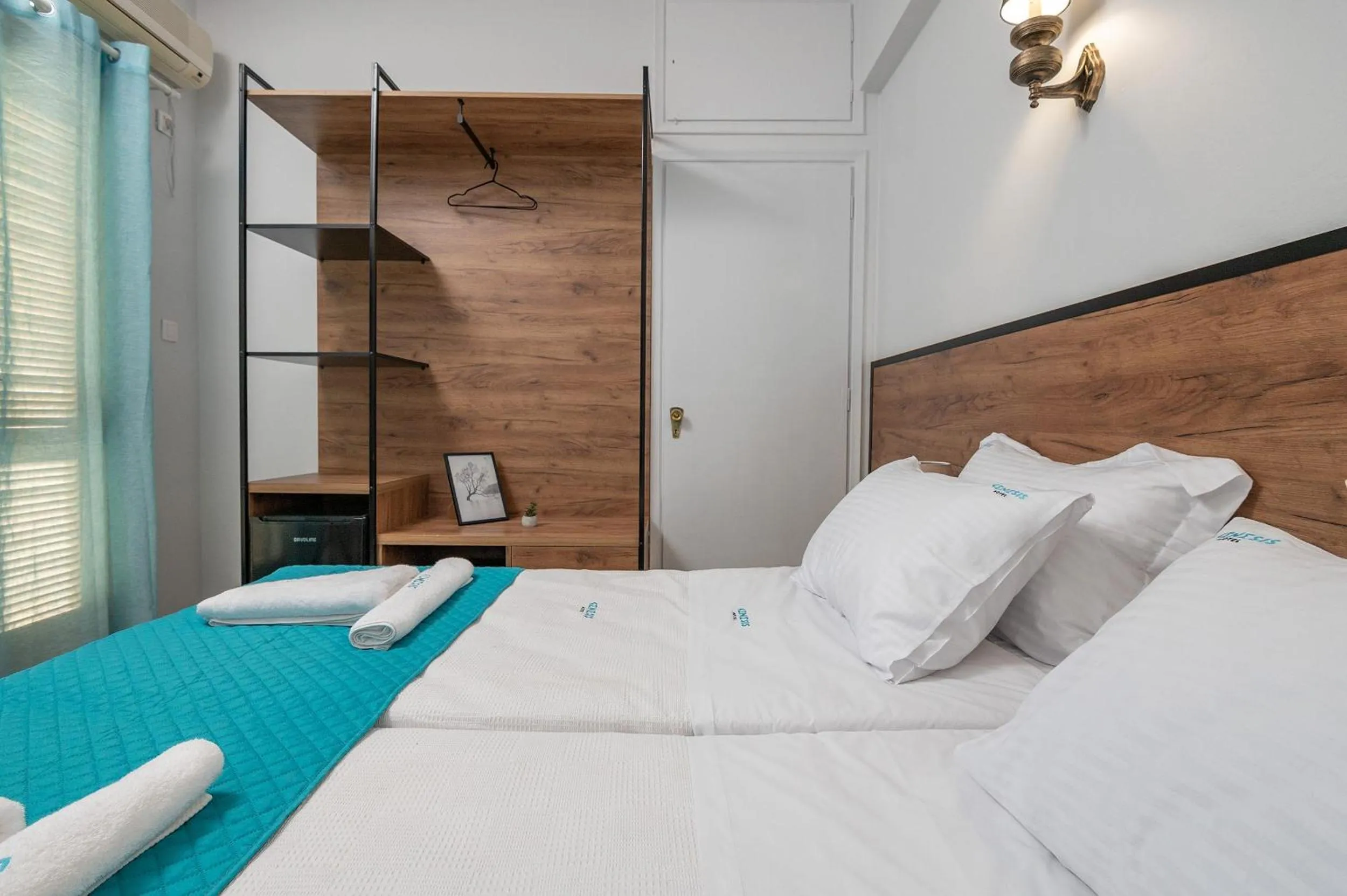 Bed in Genesis Hotel