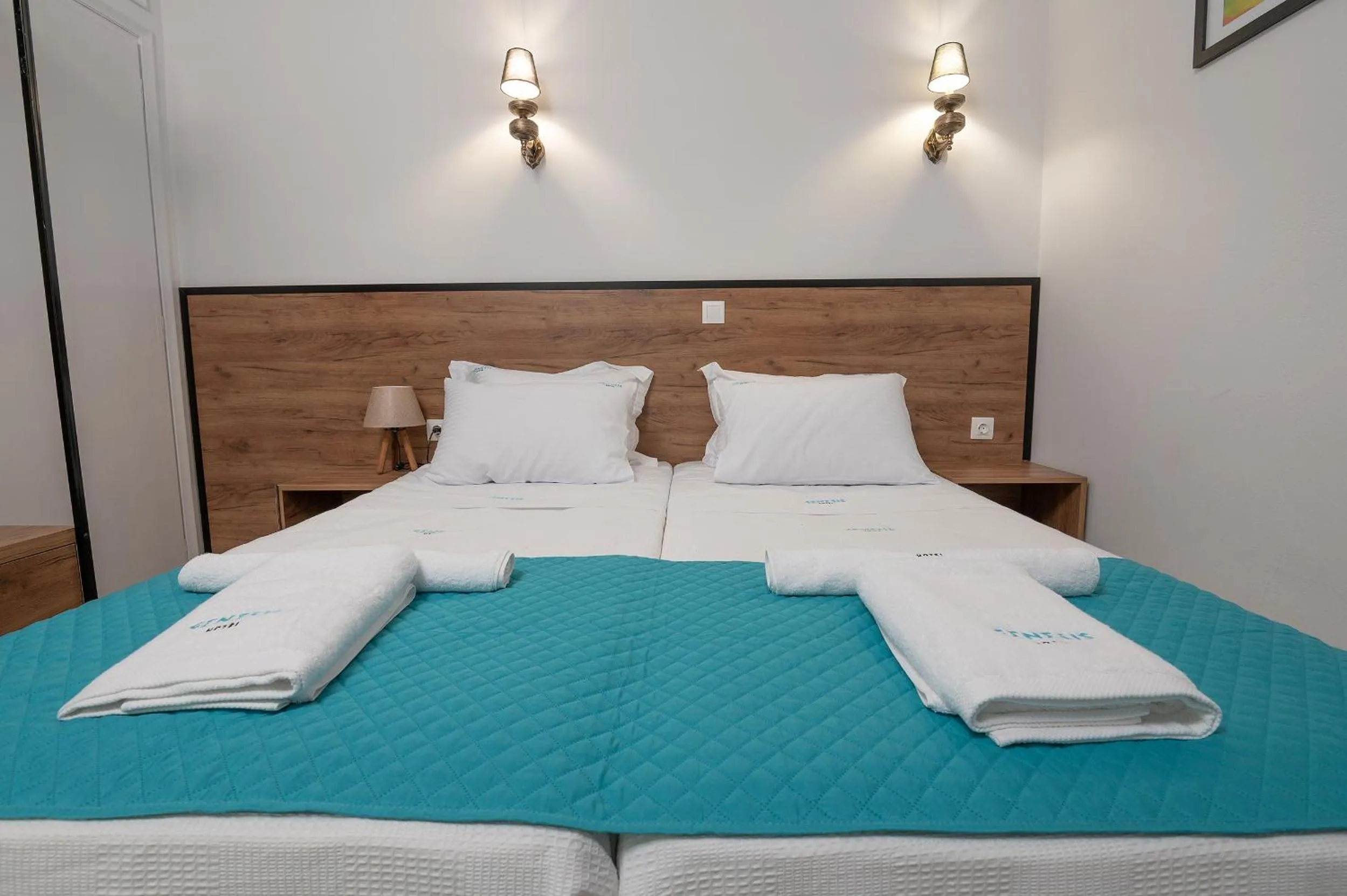 Bed in Genesis Hotel