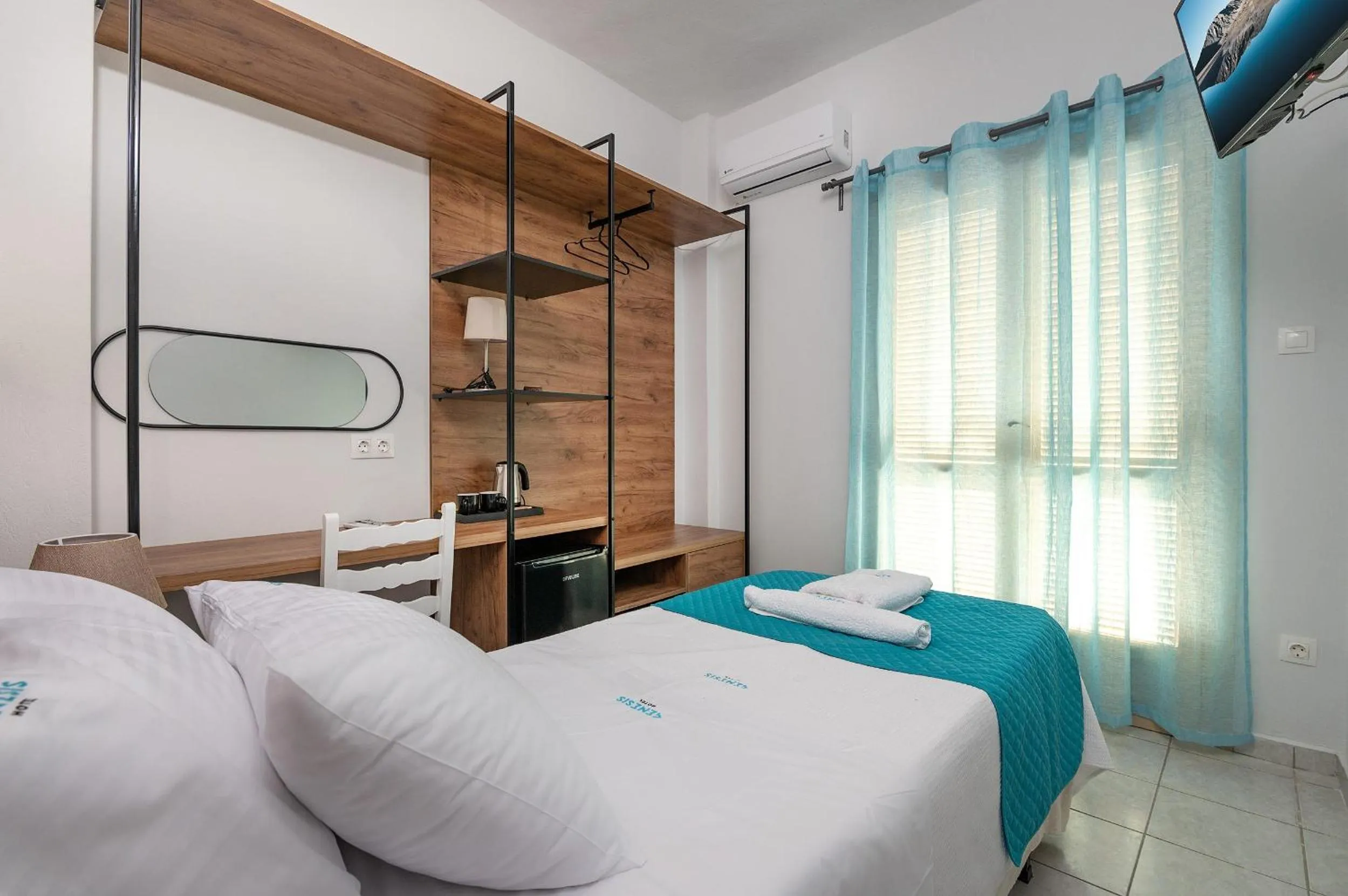 Bed in Genesis Hotel