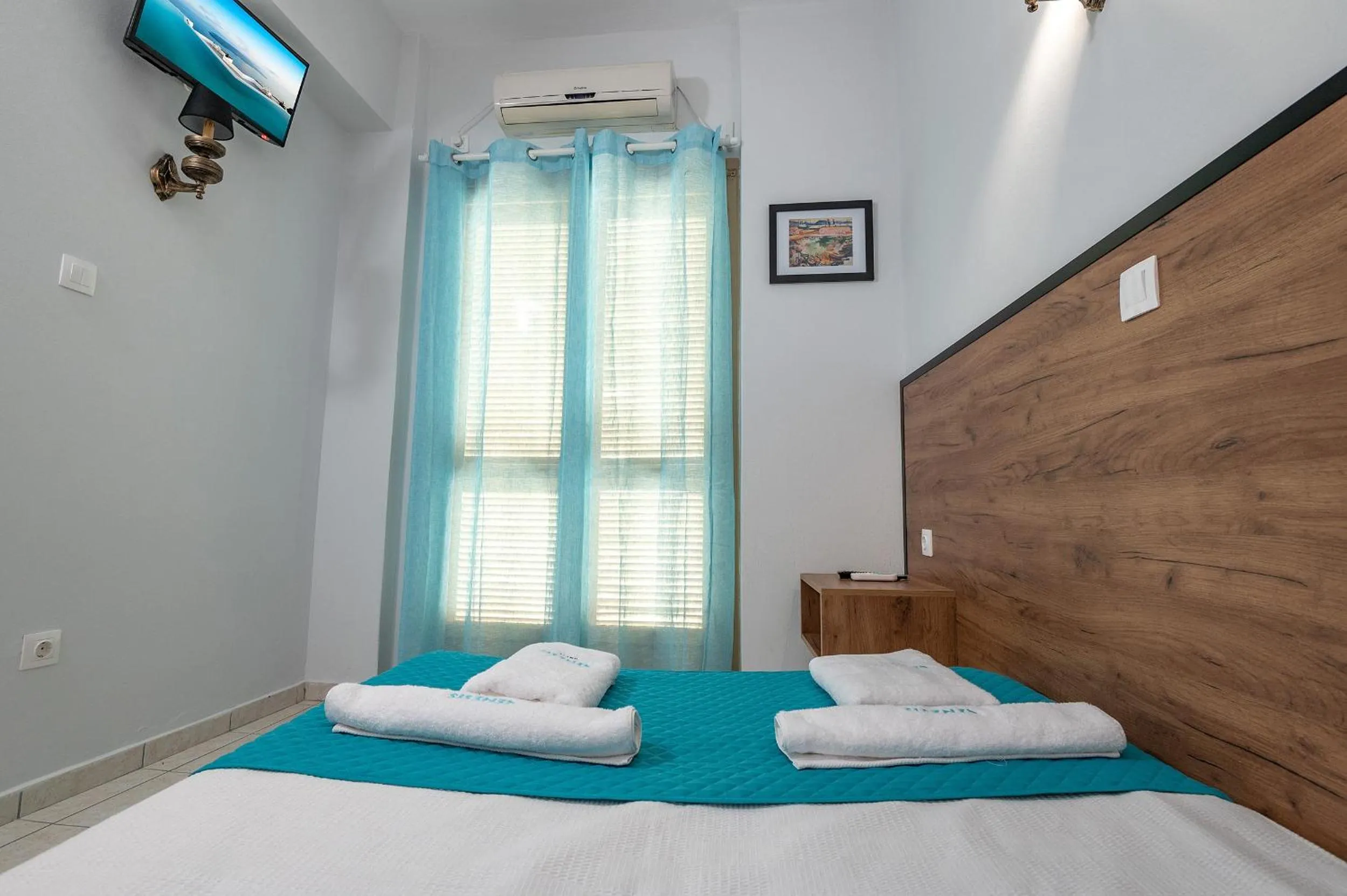 Bed in Genesis Hotel