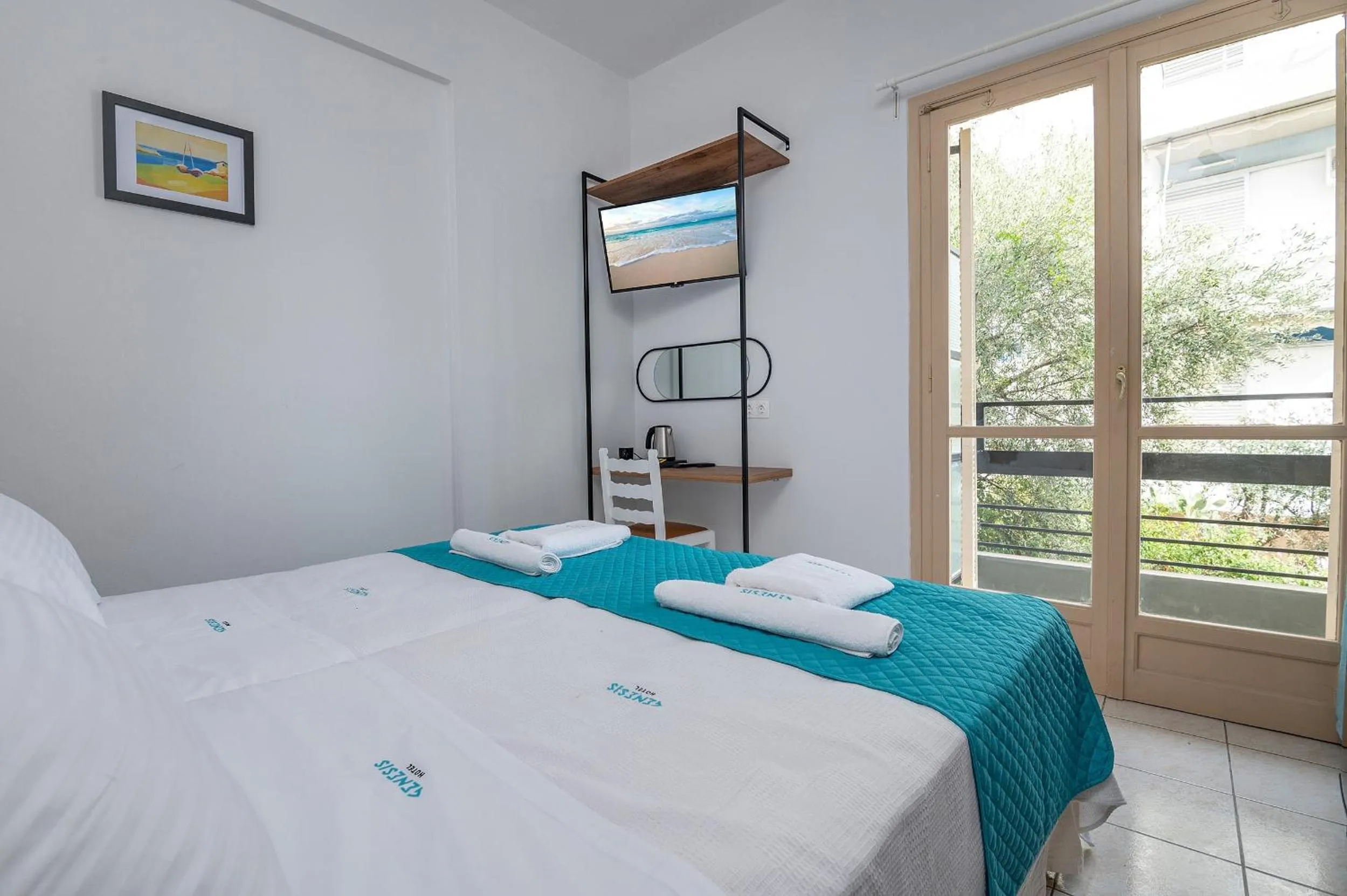 Bed in Genesis Hotel