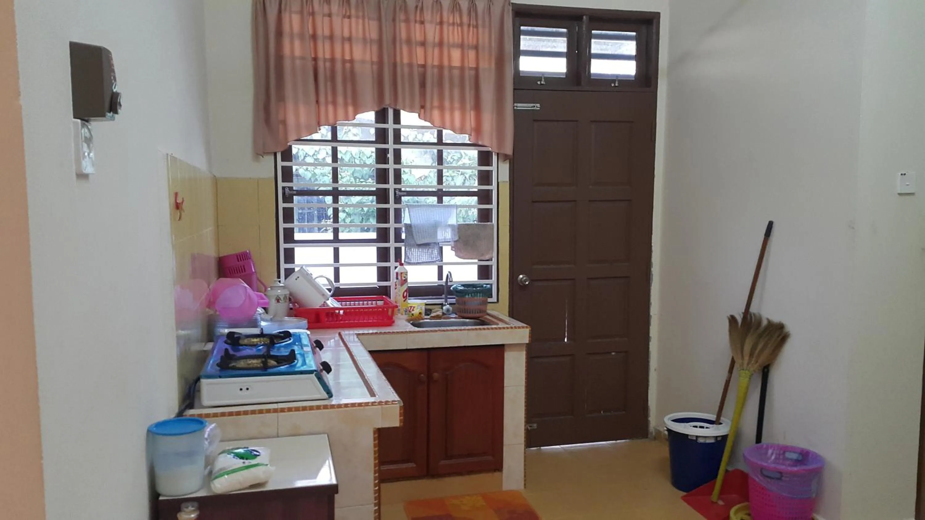 Kitchen or kitchenette in MJ Homestay Kota Bharu