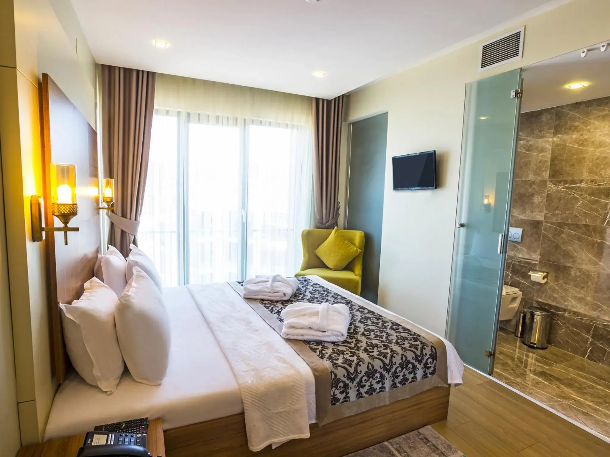 Bed in Alesha Suite Otel Bed in Alesha Suite Otel