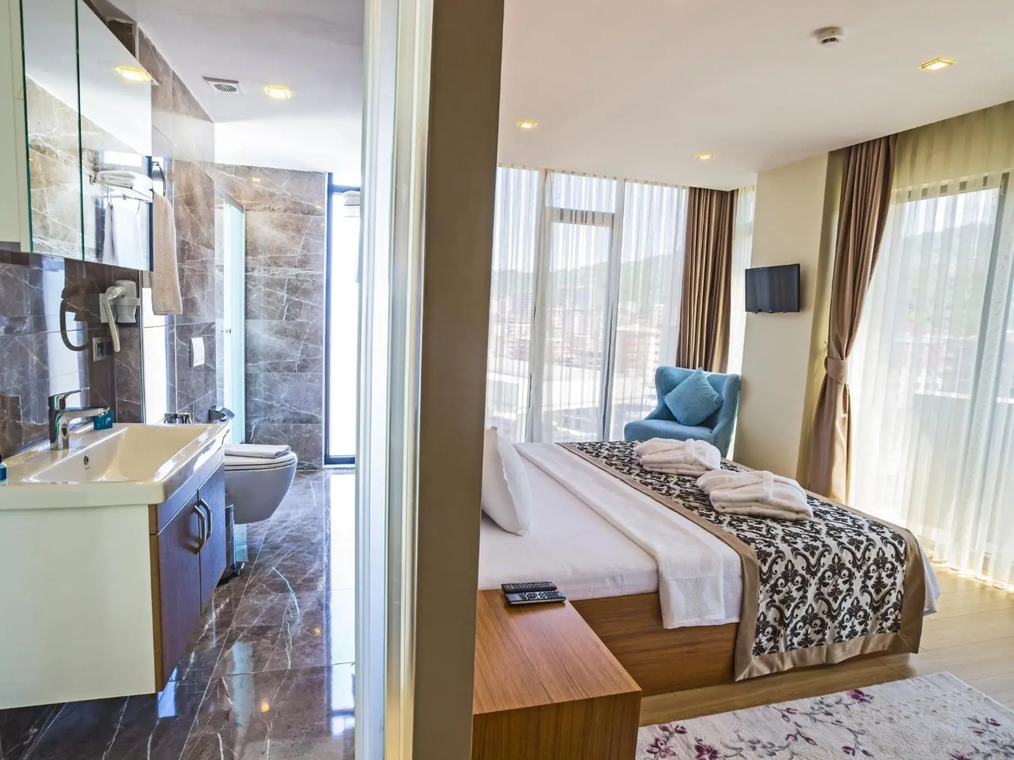 Bed in Alesha Suite Otel Bed in Alesha Suite Otel