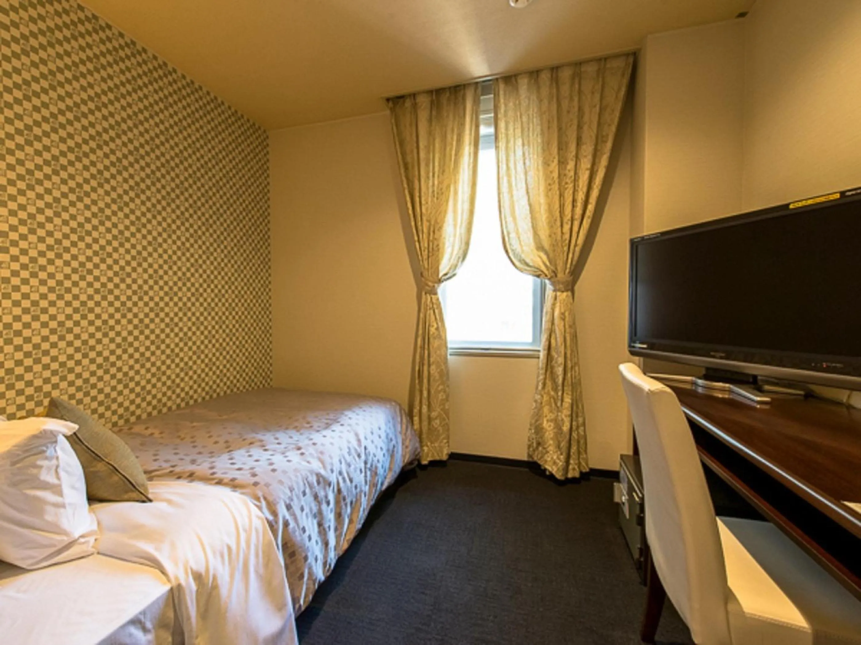 Bed in LiVEMAX RESORT Kaga Yamashiro