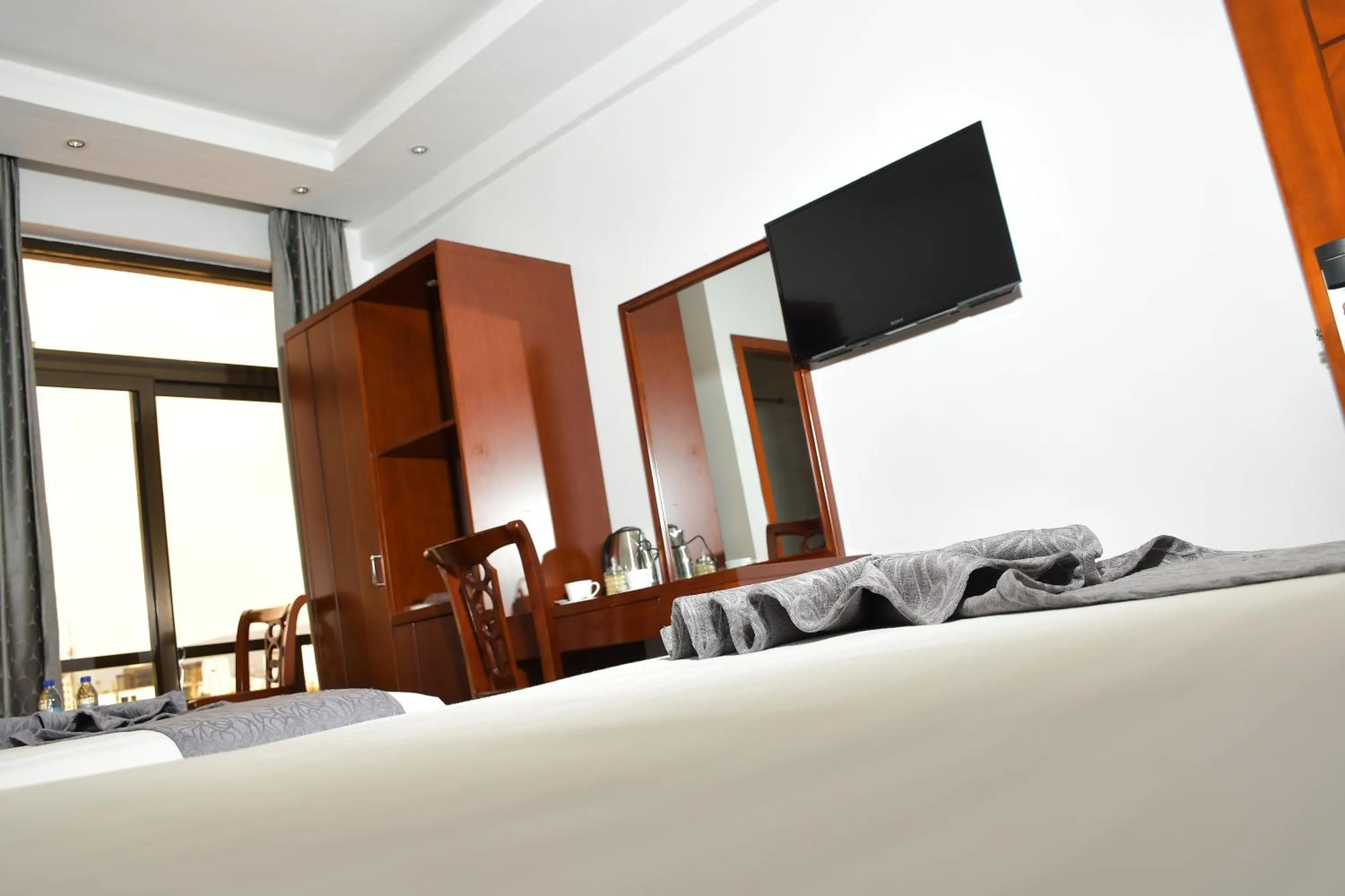 Communal lounge/ TV room, Bed in Sun View Hotel